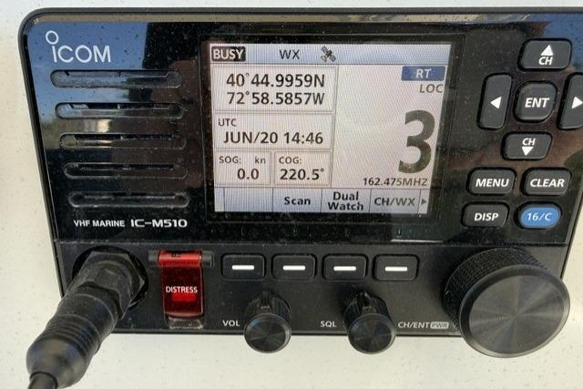 ICOM VHF Marine IC-M510 radio displaying coordinates and settings on a 2006 Sailfish 2660 CC boat.