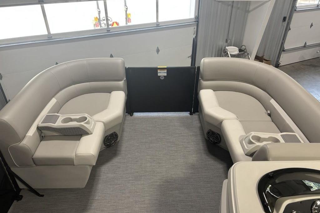 Interior of 2026 Godfrey Xperience 2086 SFLX boat with plush seating and cup holders.