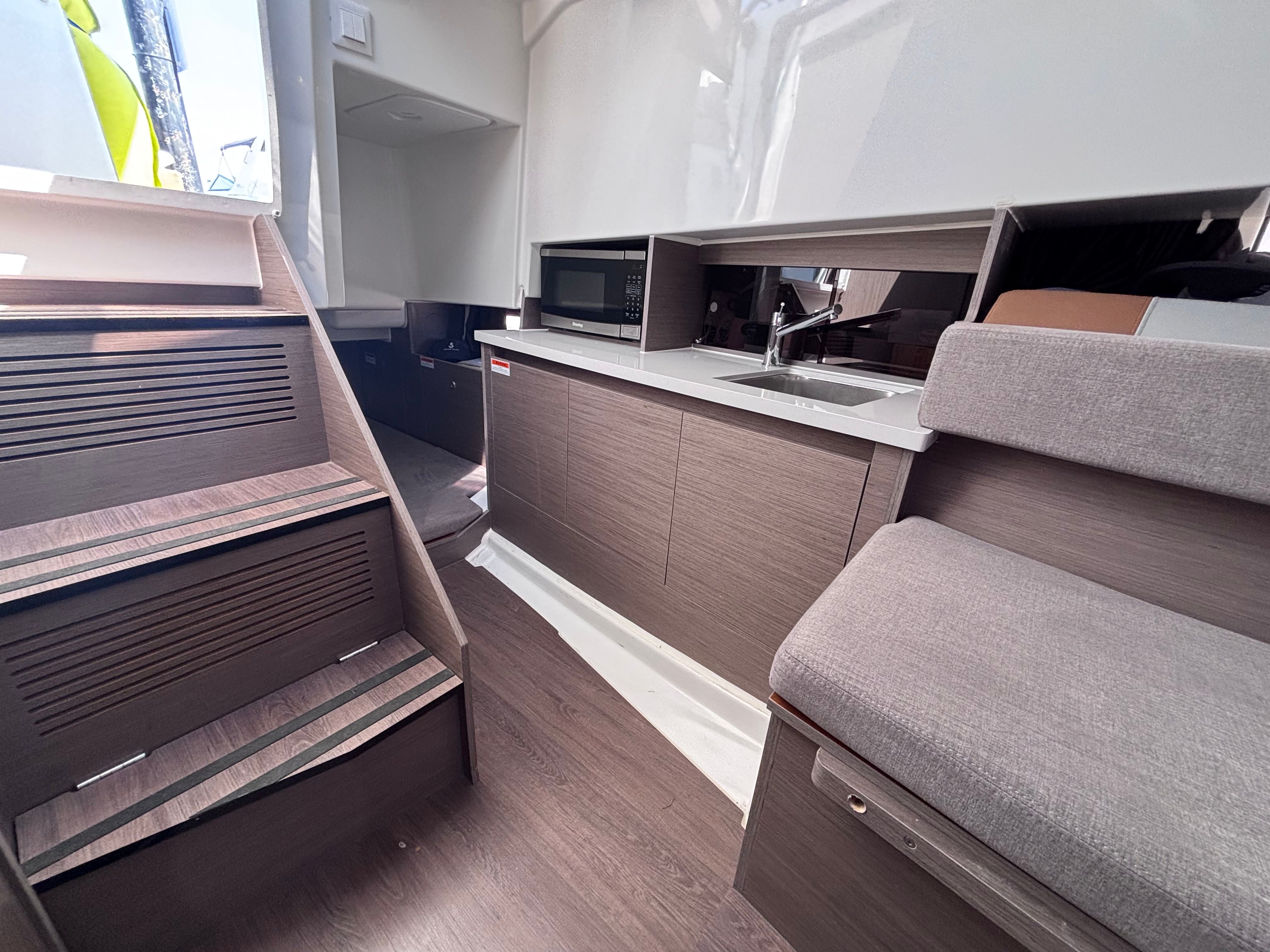 Interior of 2023 Beneteau Flyer 9 SUNdeck with modern kitchen.