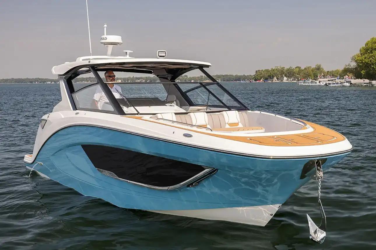 Manufacturer Provided Image: 2026 Hurricane SunDeck 3200 OB boat on a calm lake, featuring sleek design and modern amenities.