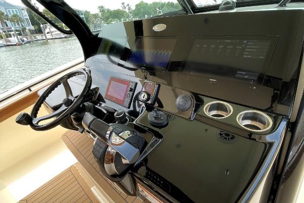 2020 Scout 420 LXF boat dashboard with steering wheel and navigation controls.