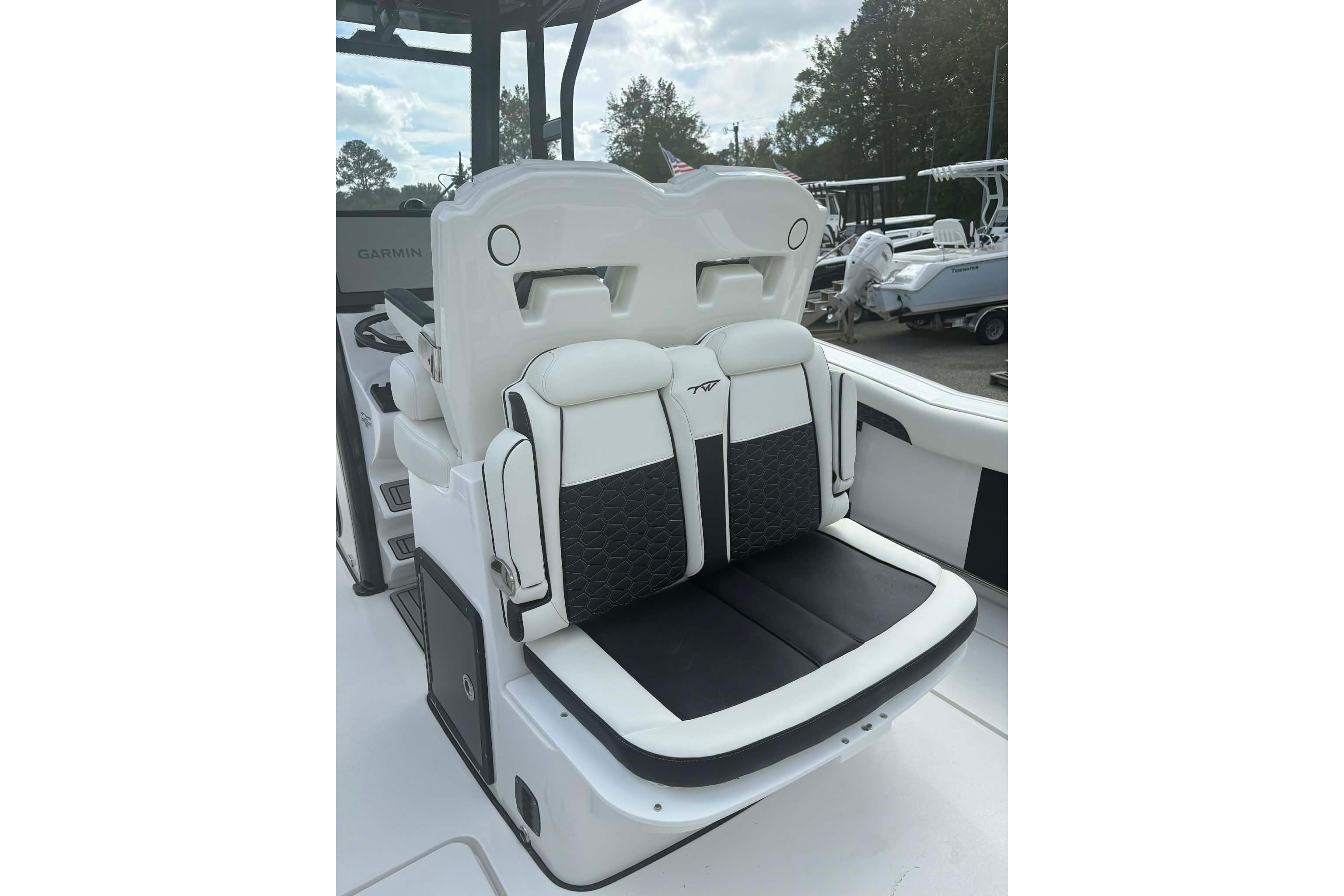 2026 Tidewater 282 CC Adventure boat seating with black and white upholstery.