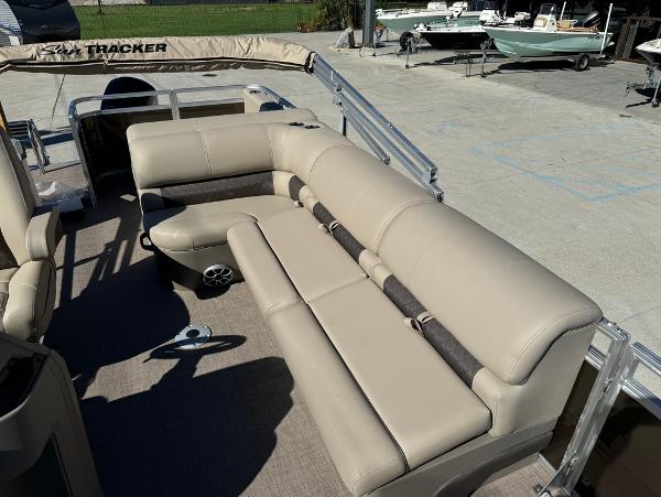 2025 Sun Tracker 24 Sportfish XP3 pontoon boat with beige seating and spacious deck.