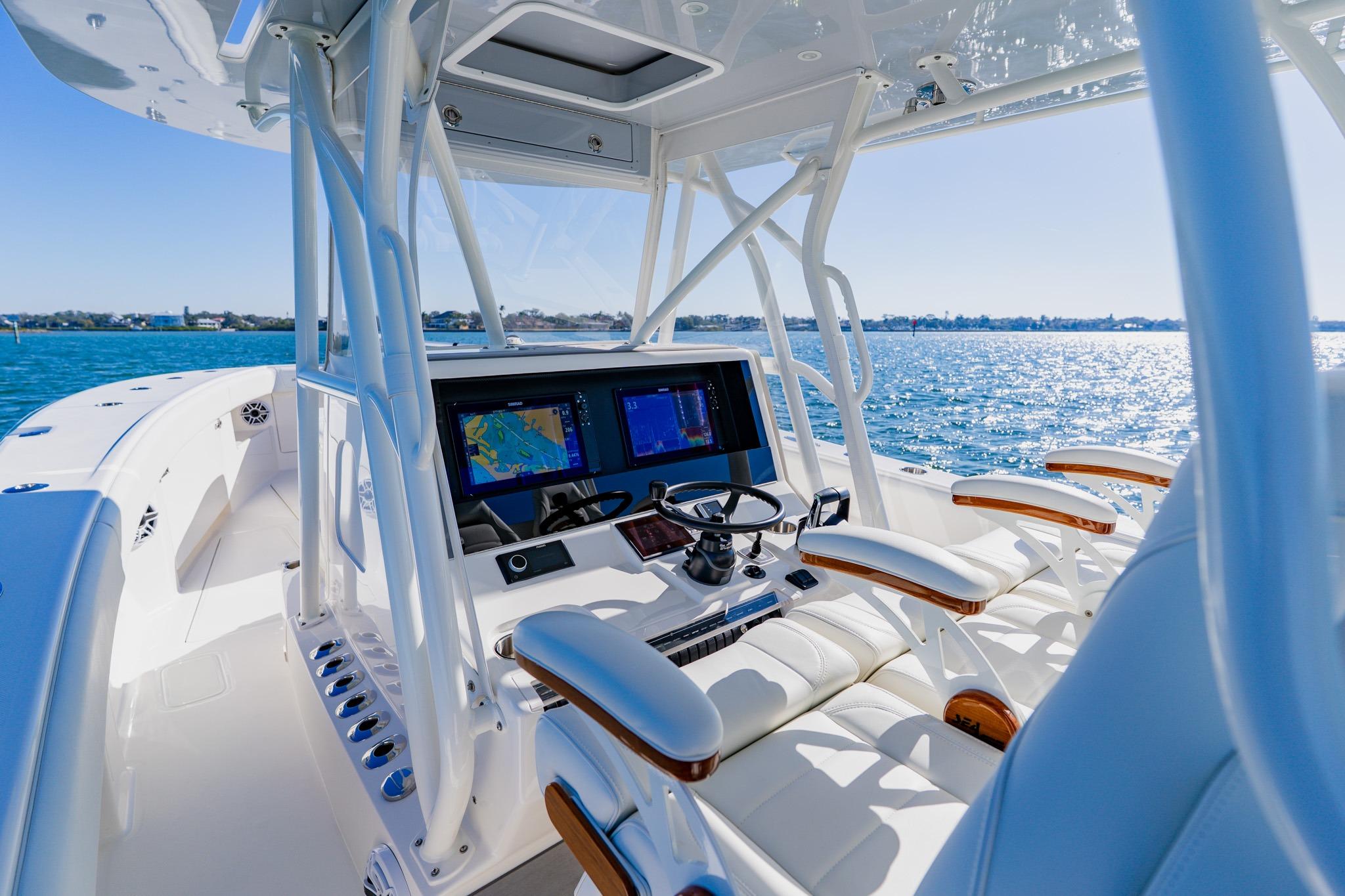 2025 SeaVee 370Z boat cockpit with advanced navigation system on a sunny day.