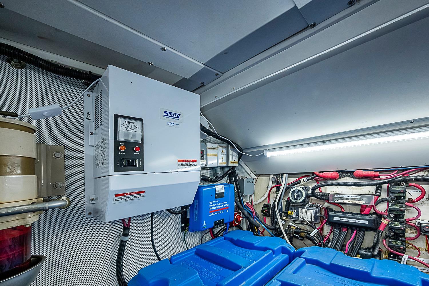Engine room of 2003 Magna Marine Nova Scotia 47, featuring electrical systems and wiring.