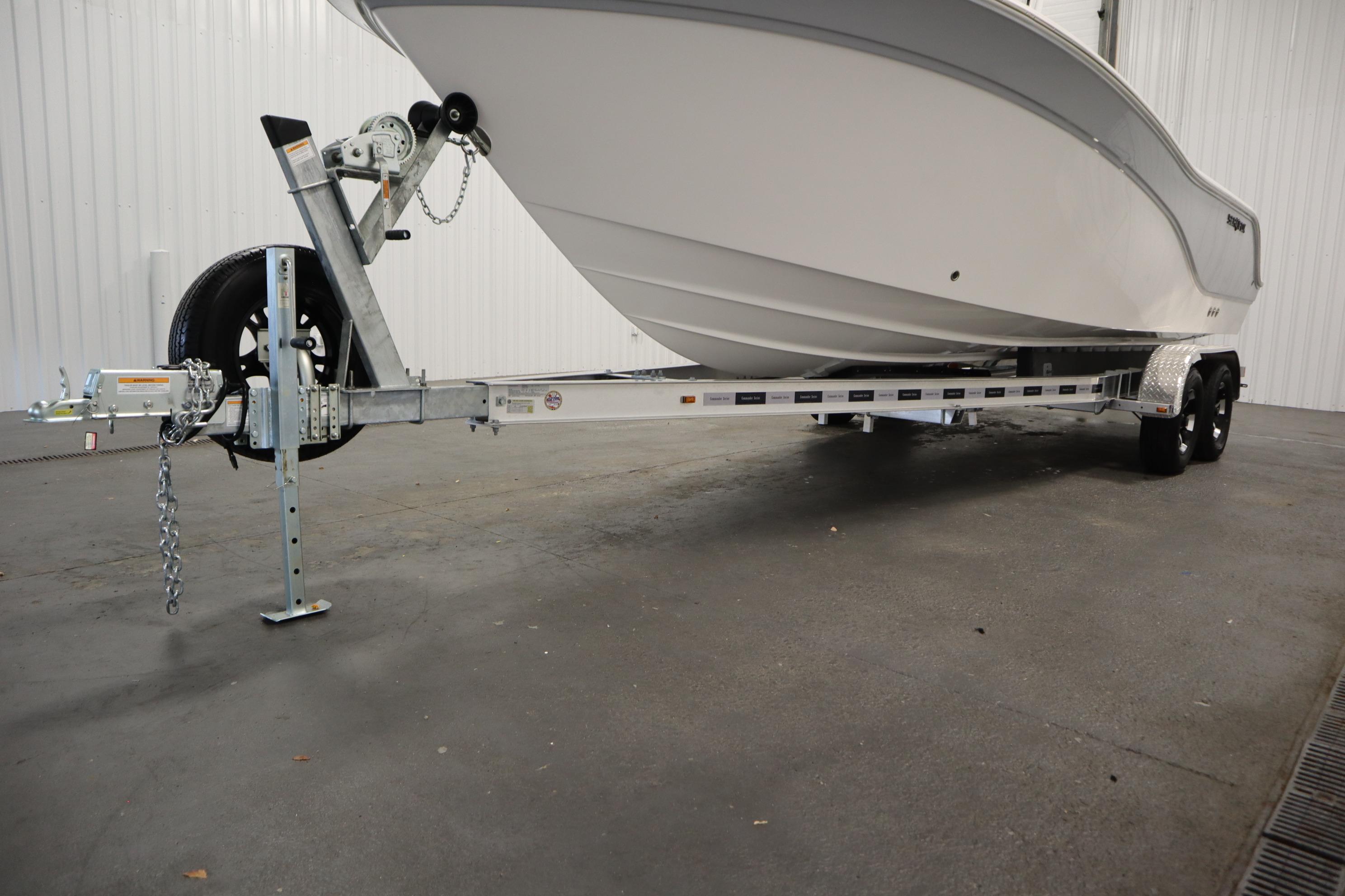 2026 Sea Fox 228 Commander boat on trailer in indoor storage facility.
