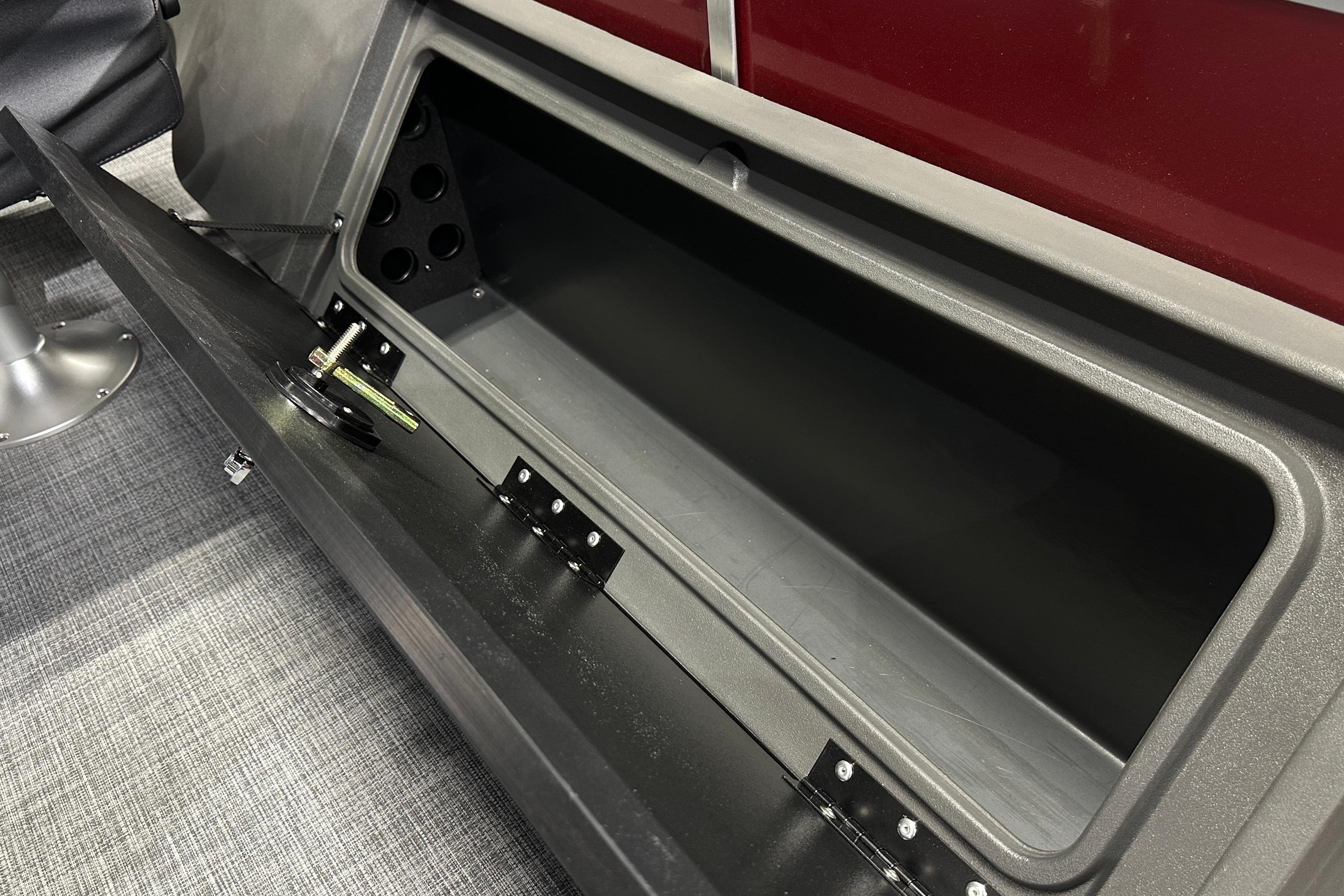 Open storage compartment on 2026 Sun Tracker SportFish 22 DLX boat.
