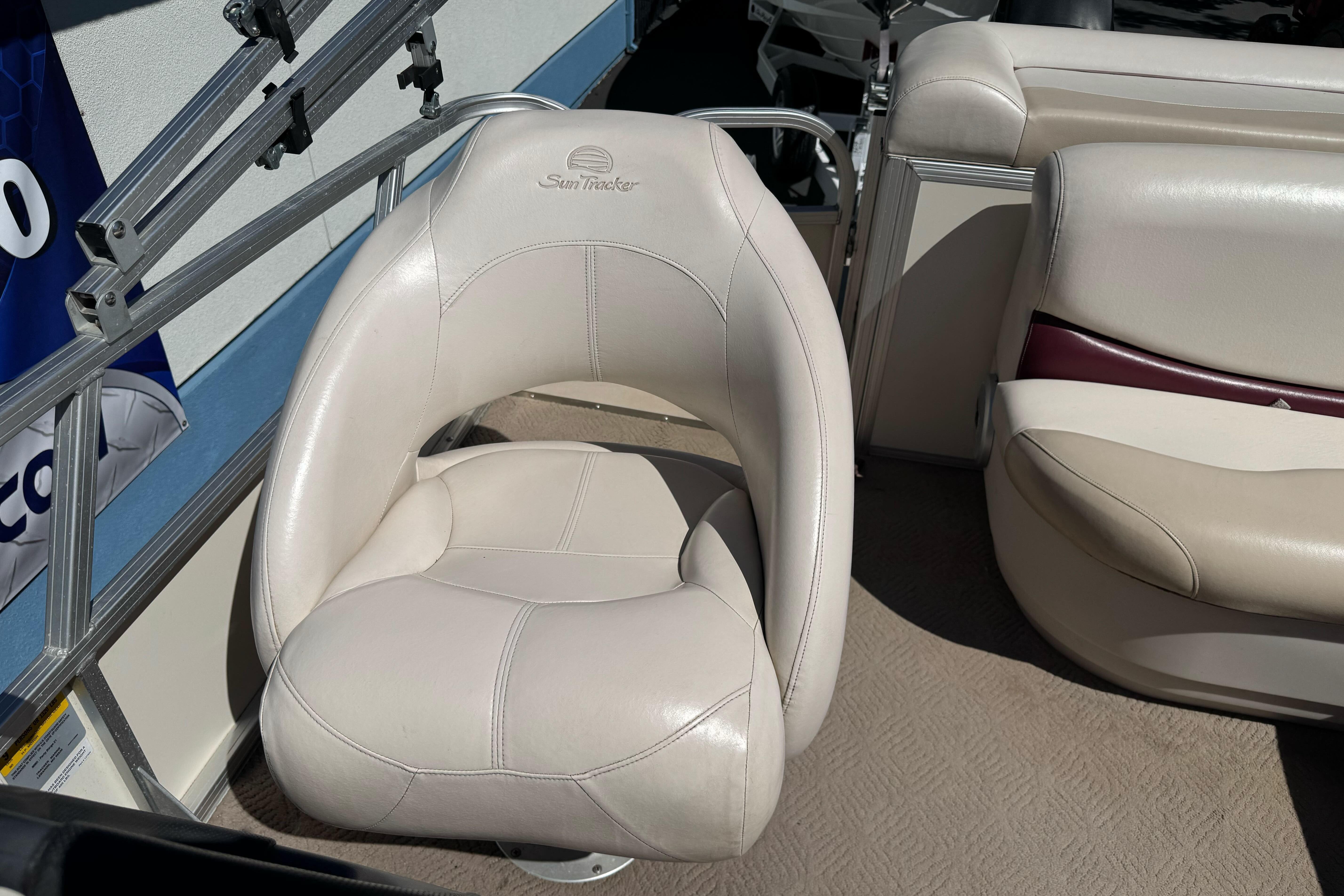 2011 Sun Tracker Party Barge 21 boat seat, white leather, comfortable design.