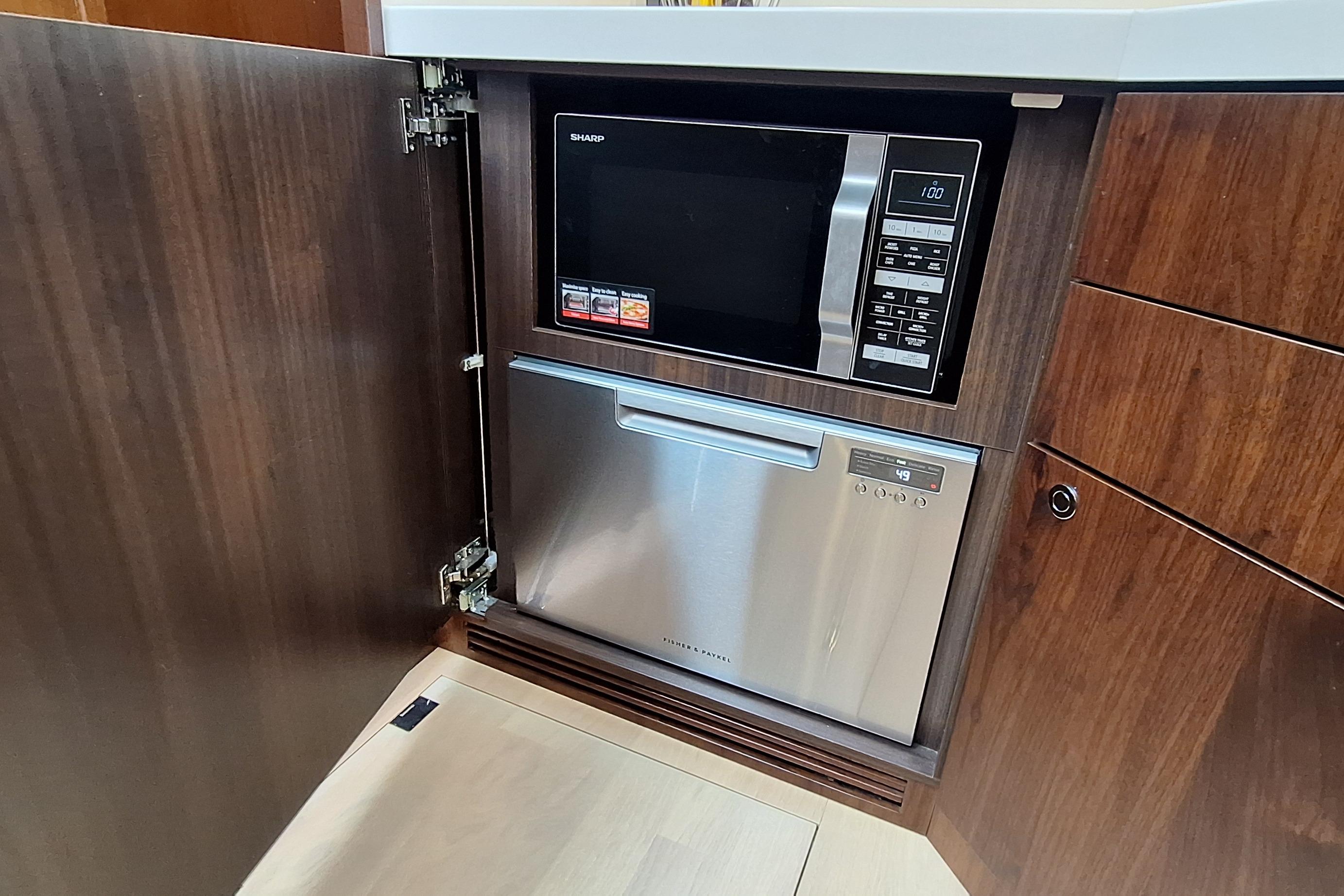 Built-in microwave and dishwasher in 2022 Fairline Targa 53 yacht kitchen.