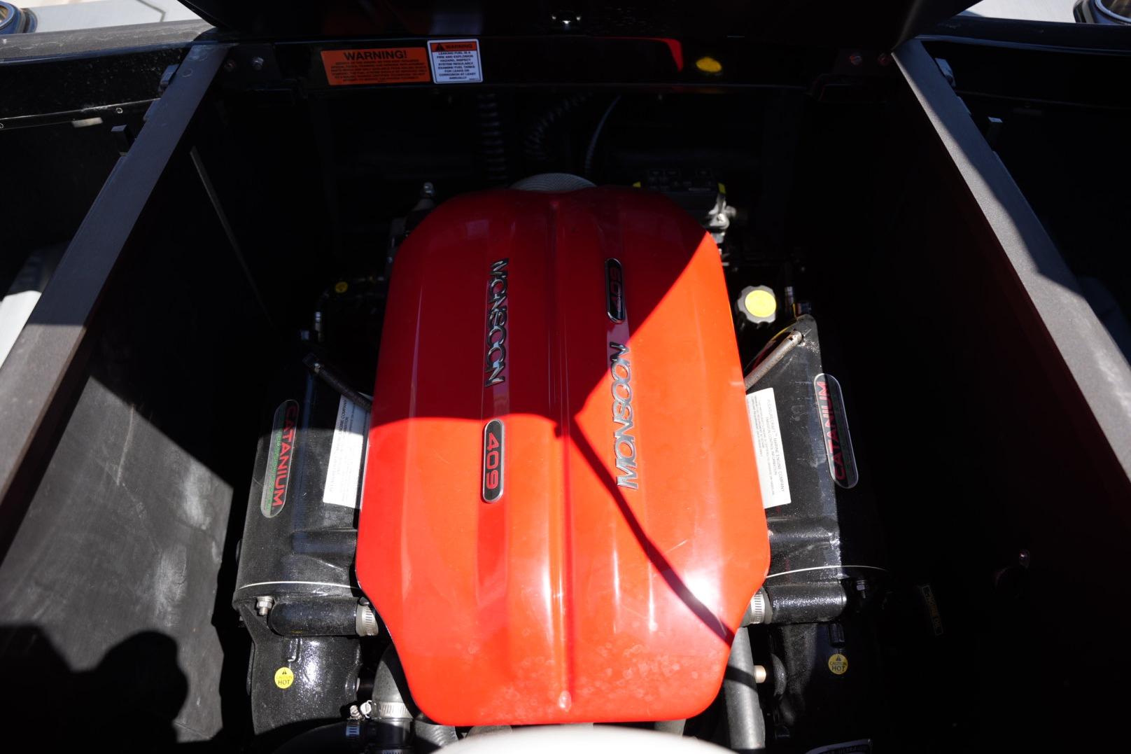 Engine compartment of a 2019 Axis A22 boat featuring a Monsoon 409 engine.