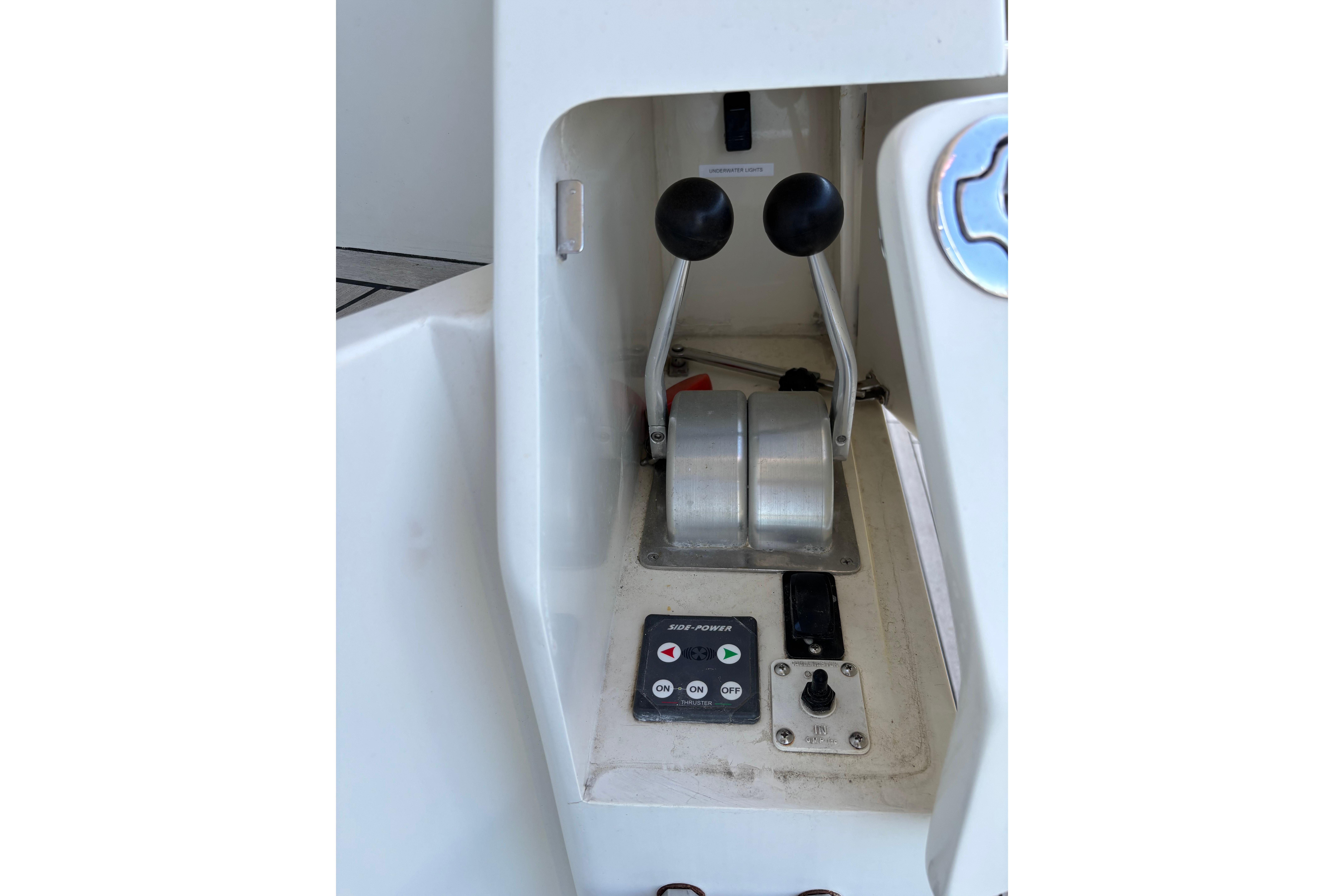 Control panel of a 2004 Hampton F/B Cruiser boat with dual throttle levers.