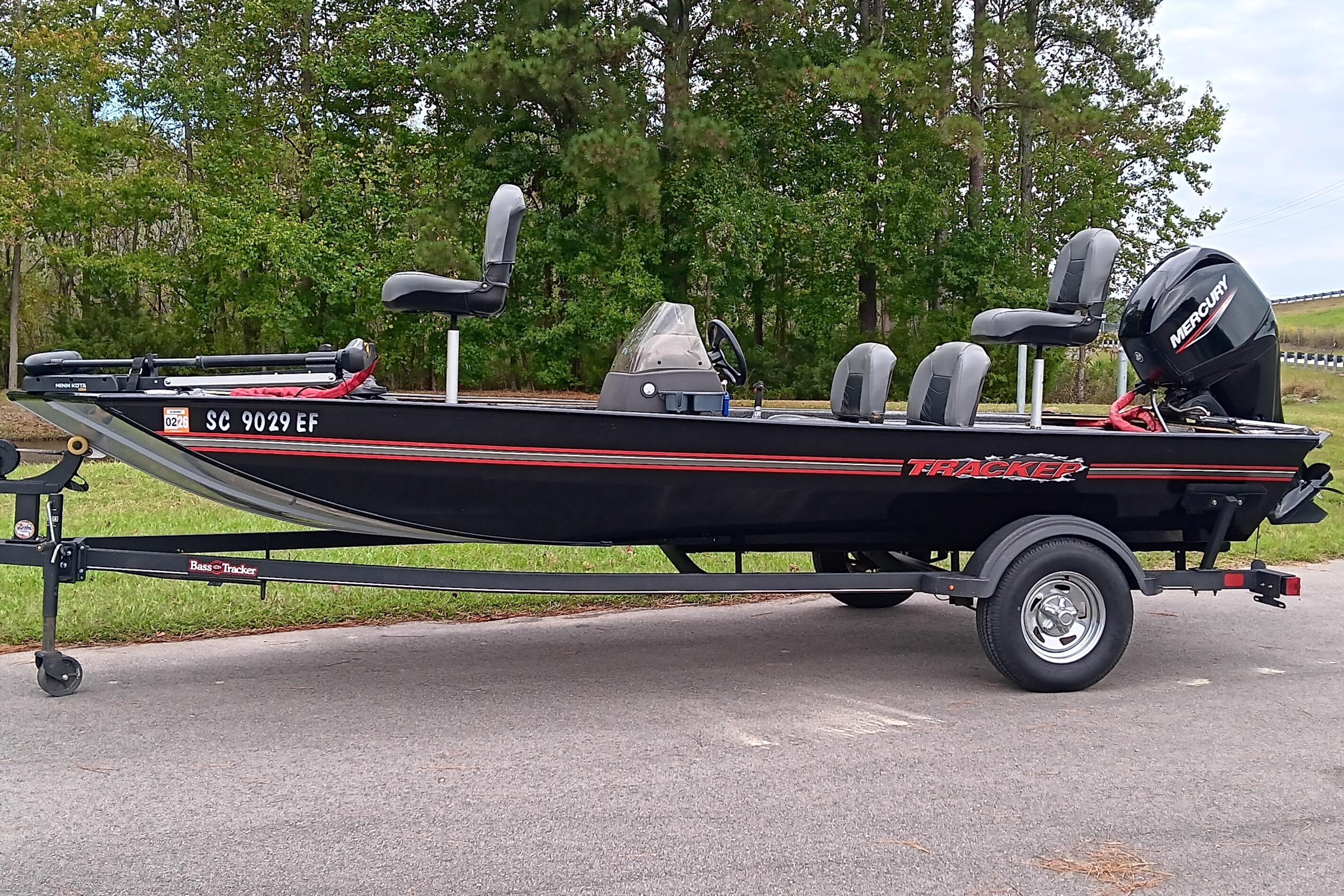 2023 Tracker Bass Tracker Classic XL boat on trailer, parked outdoors.