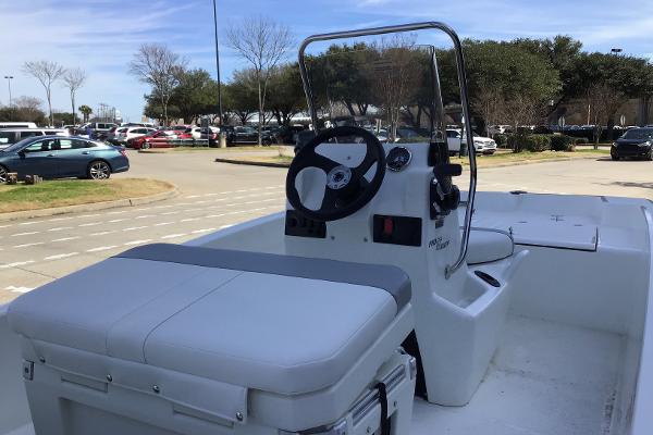2025 Mako Pro Skiff 15 CC boat with center console in parking lot.