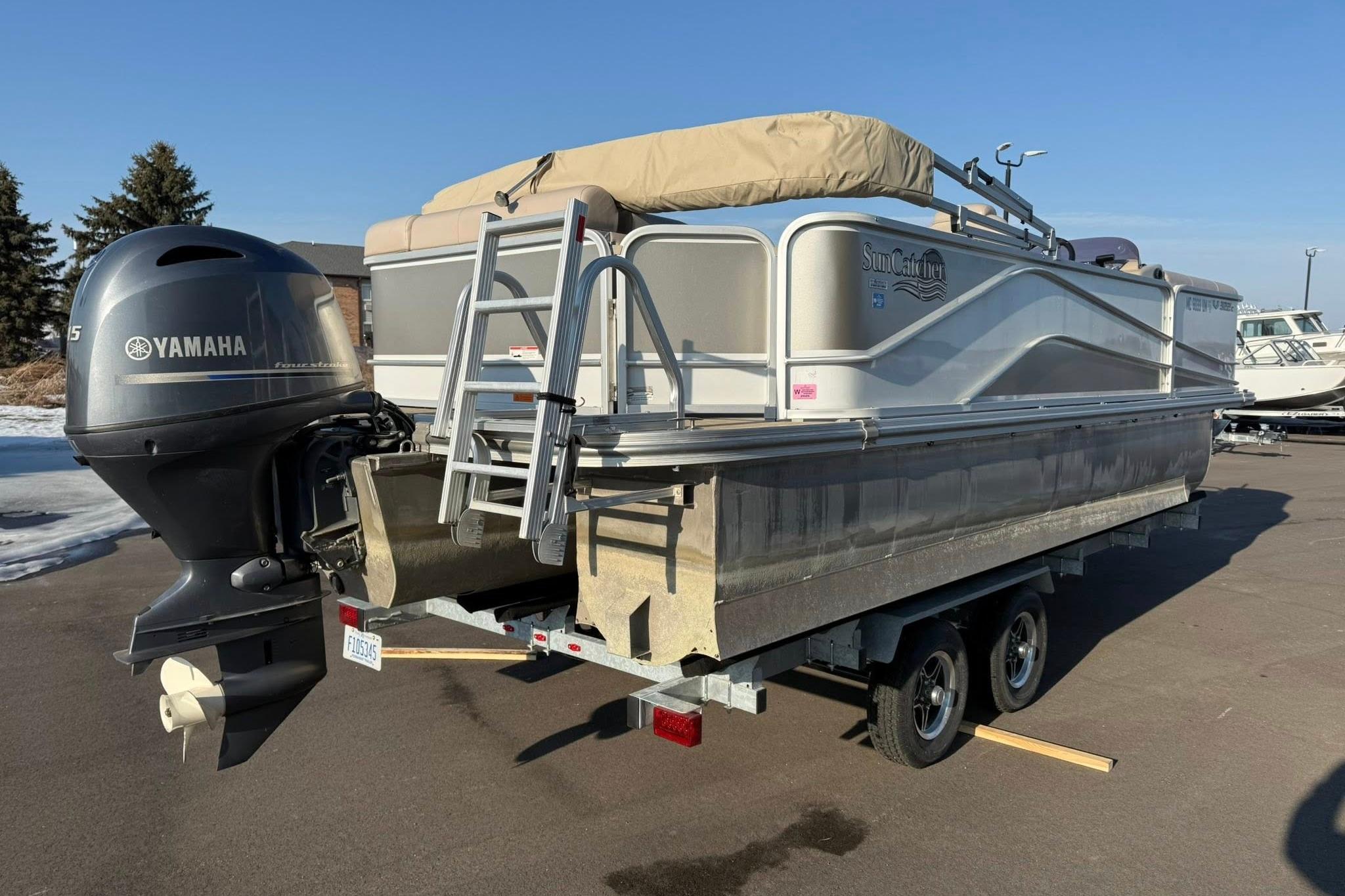 2019 SunCatcher V322 Cruise pontoon boat with Yamaha motor on trailer.