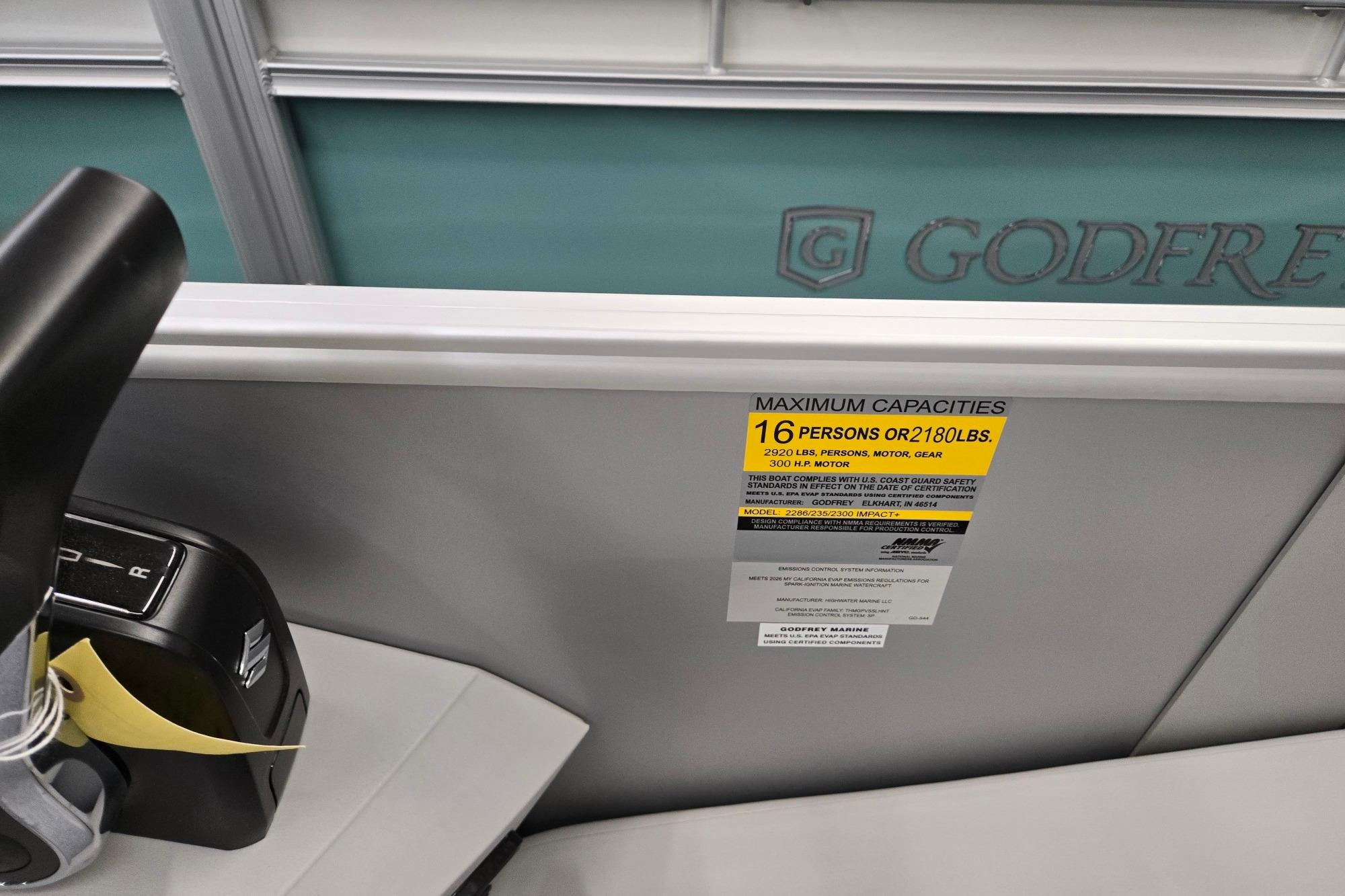 2026 Godfrey Sweetwater 2286 FS boat capacity label, seating for 16, 2180 lbs limit.