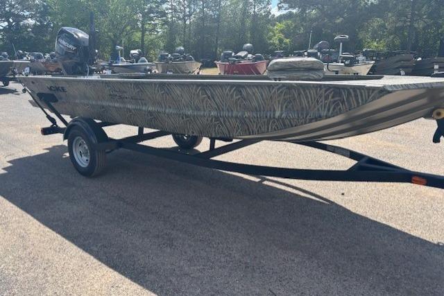 2026 Tracker Grizzly 1654 T Sportsman boat on trailer in outdoor setting.