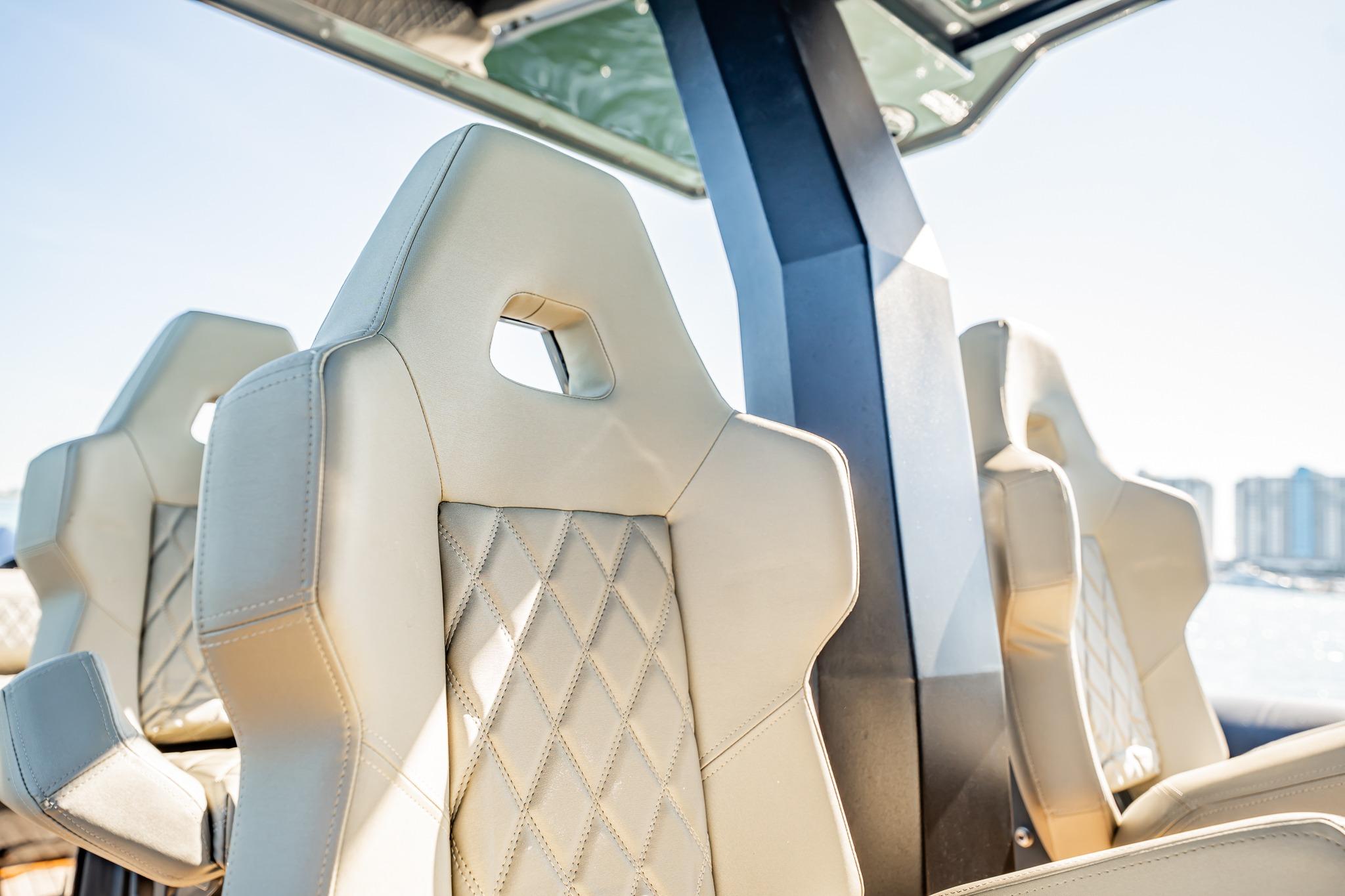 Luxurious beige seats on 2023 Skipper-BSK 38NC boat, featuring diamond stitching and modern design.