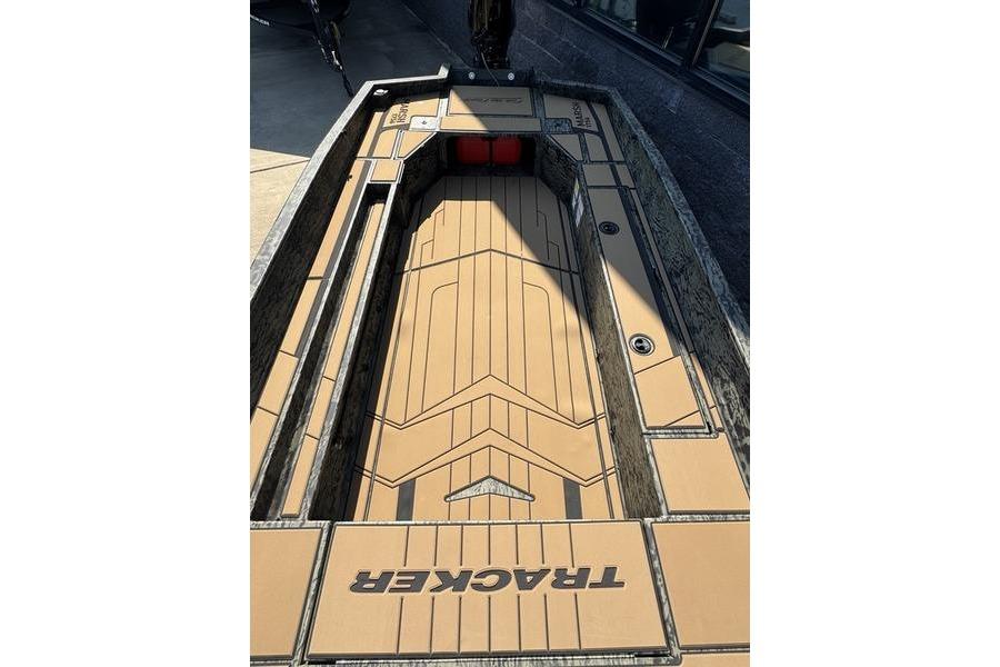 2026 Tracker Grizzly 1756 T Marsh boat interior with tan deck and storage compartments.