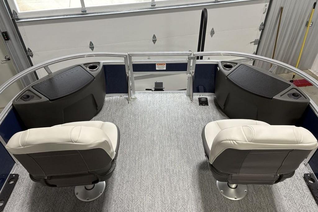 2026 Sun Tracker Bass Buggy 18 DLX interior with two swivel seats and storage compartments.