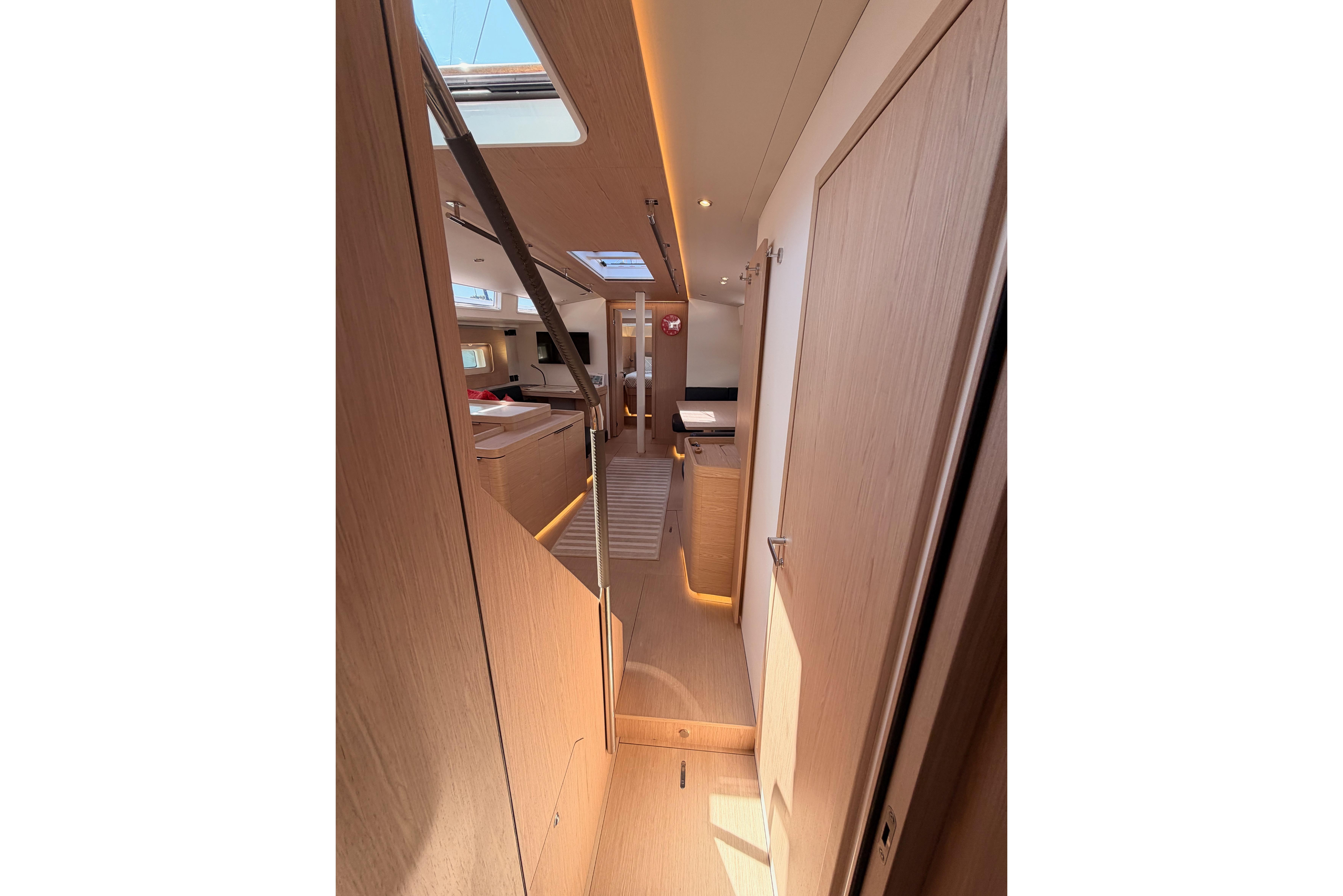 Interior of 2022 Beneteau Oceanis Yacht 54, featuring modern design and natural lighting.