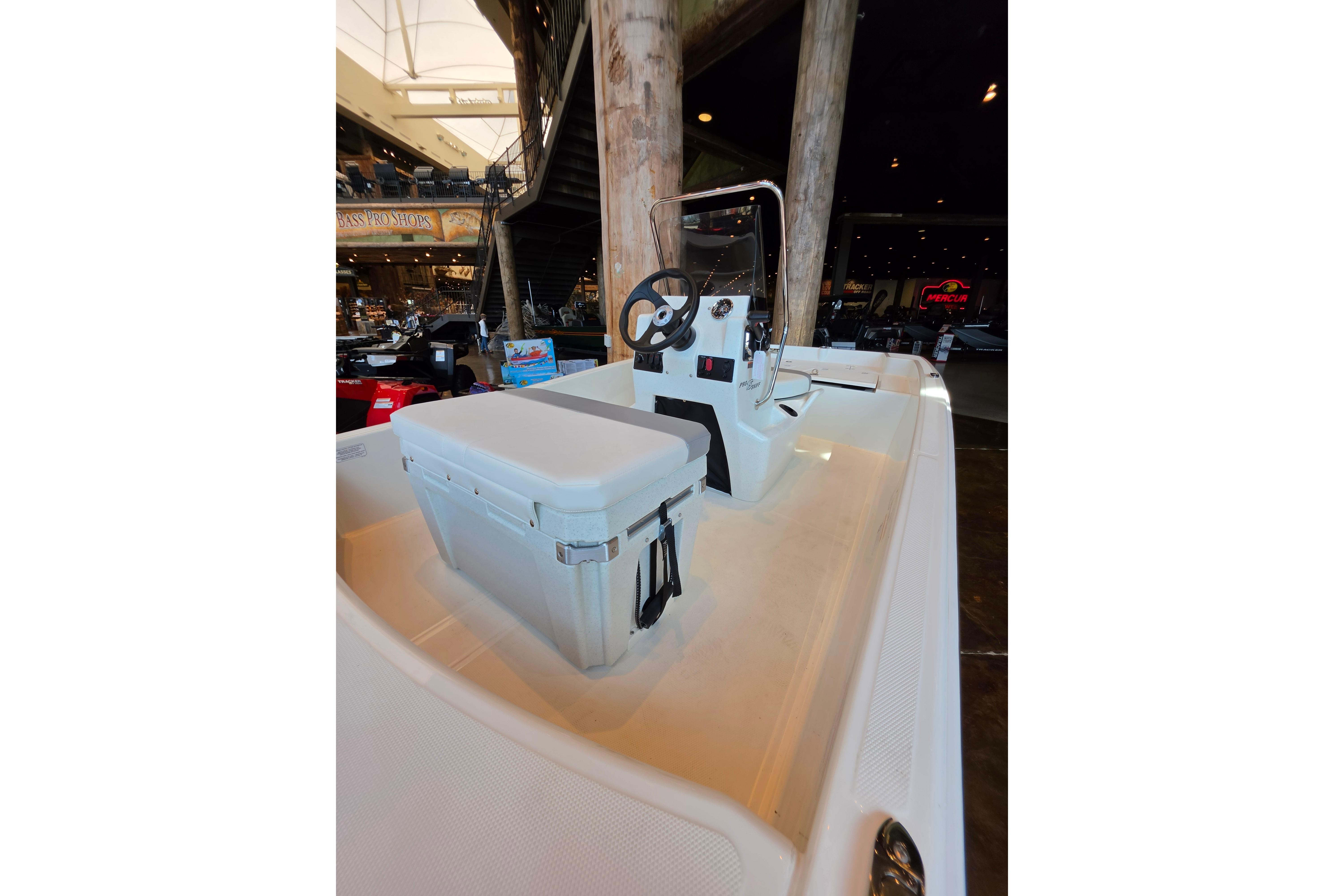 2026 Mako Pro Skiff 15 CC boat interior with console and seating.