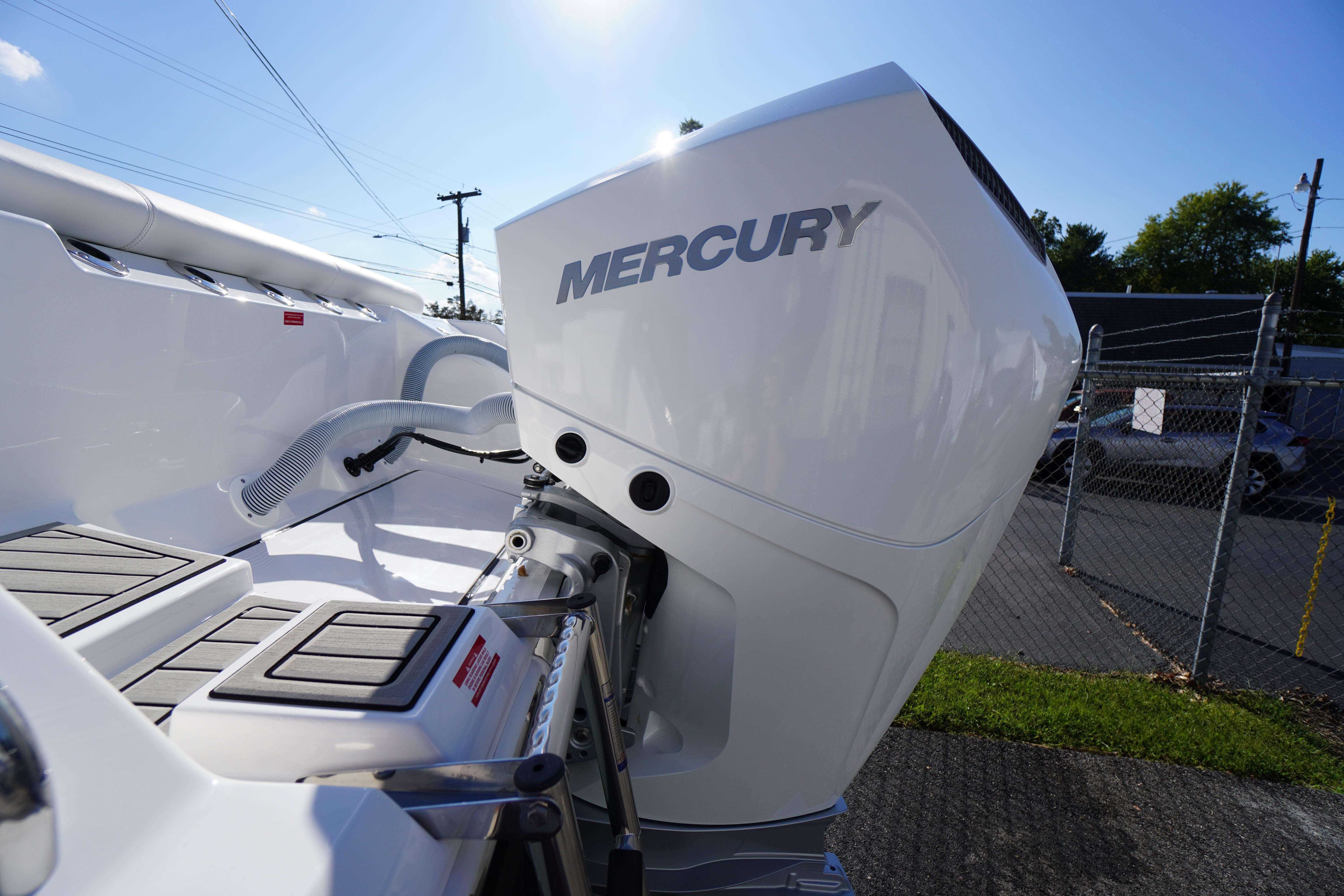 2026 Tidewater 272 LXF boat with Mercury outboard engine, docked under clear blue sky.