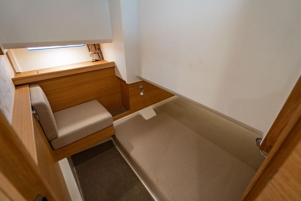 Interior of Nimbus Tender 11 yacht, 2023 model, featuring wood paneling.
