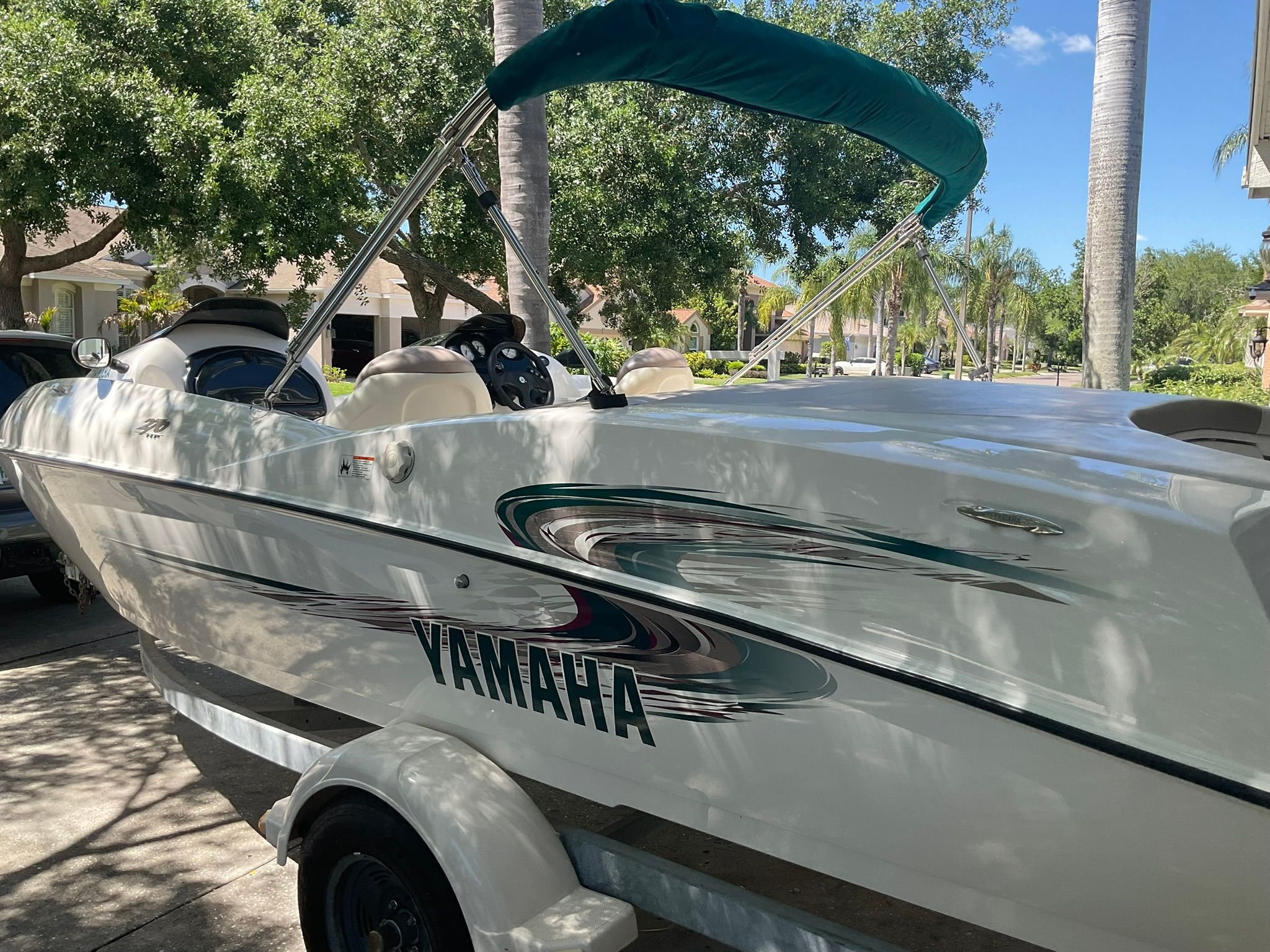 2000 Yamaha LS2000 boat parked outdoors.