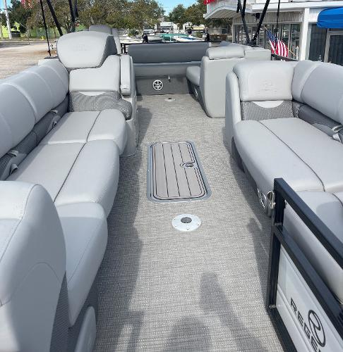 2023 Regency 250 DL3 pontoon boat with spacious seating and modern design.
