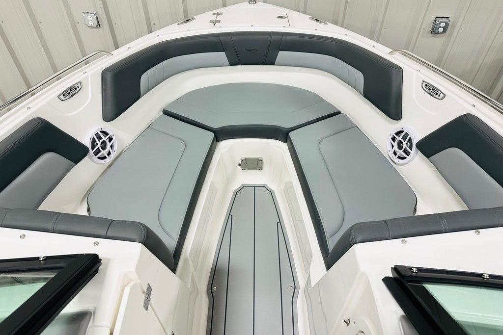 2025 Chaparral 23 SSi OB boat interior with gray seating and speakers.
