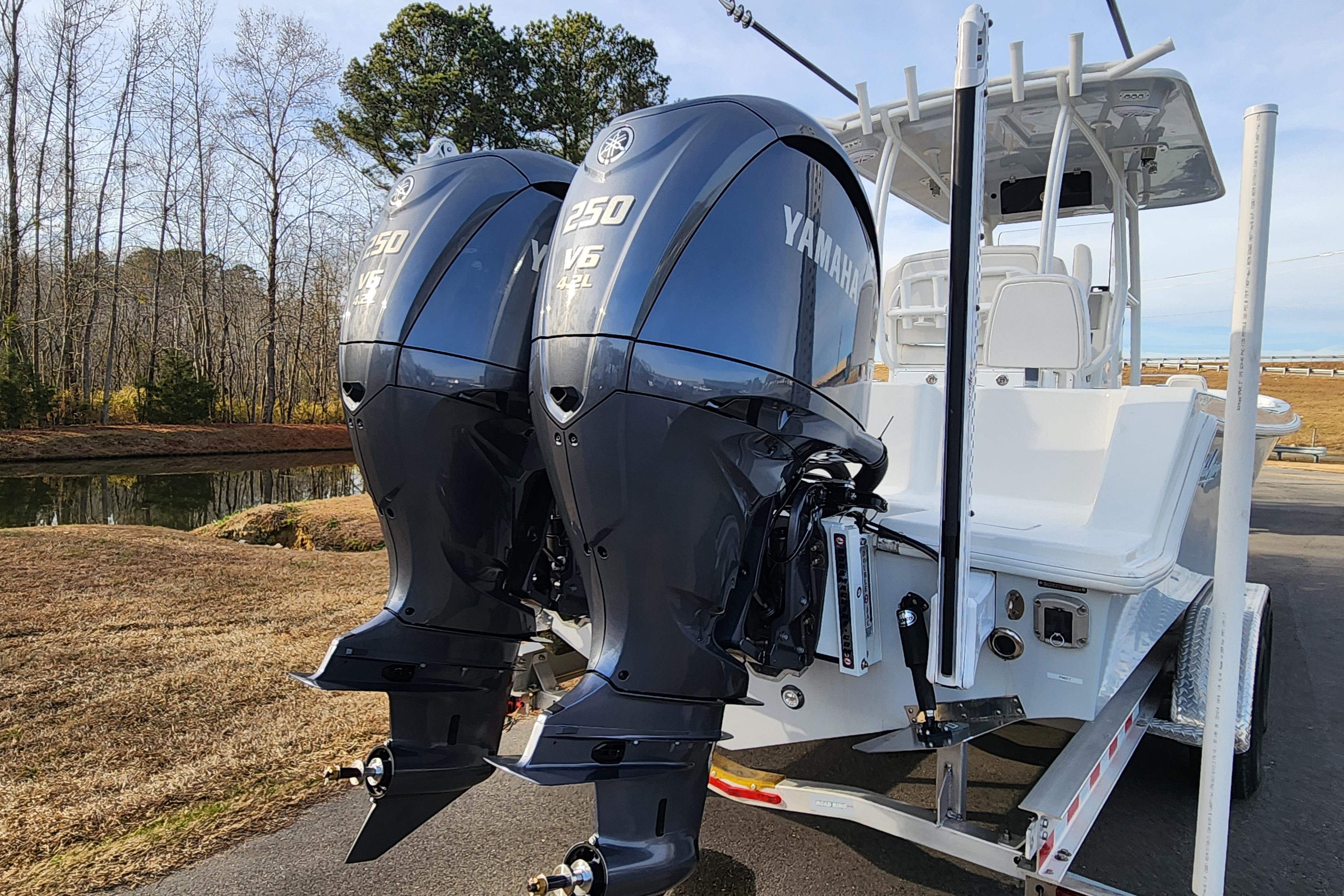 2024 Pair Customs 27 CC boat with dual Yamaha 250 V6 engines on a trailer.