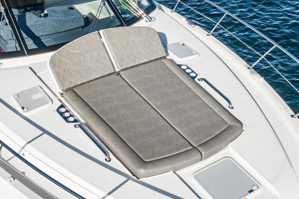 2021 Riviera 5400 Sport Yacht sunbathing deck on calm waters.