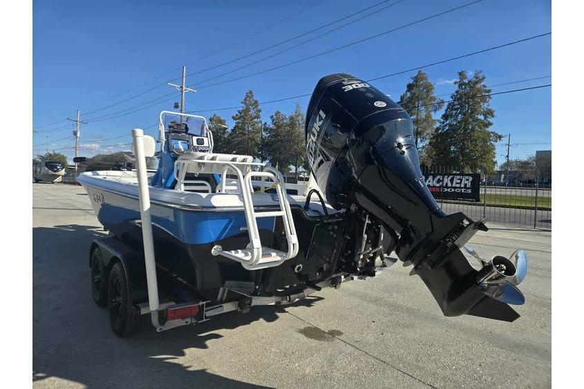 2020 Blue Wave 2400 PureBay boat with Suzuki outboard motor on trailer.
