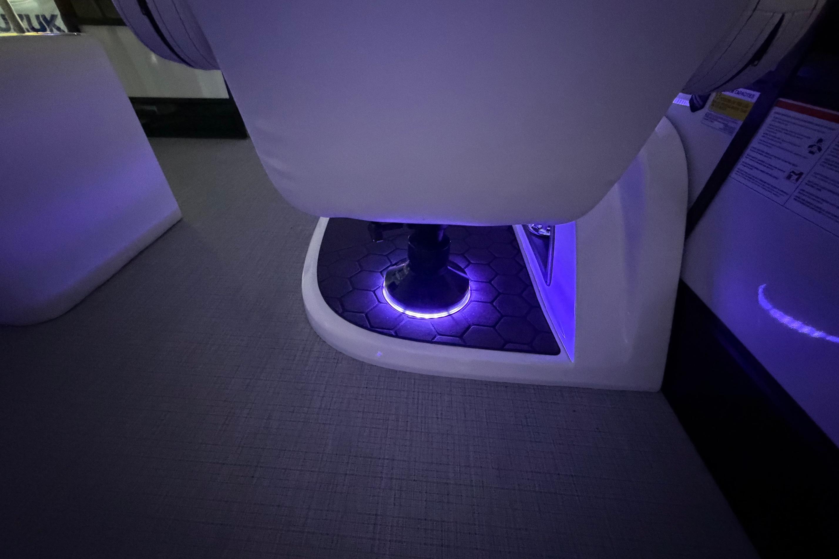 LED-lit interior of 2026 South Bay 525SB2 boat, featuring hexagonal flooring.
