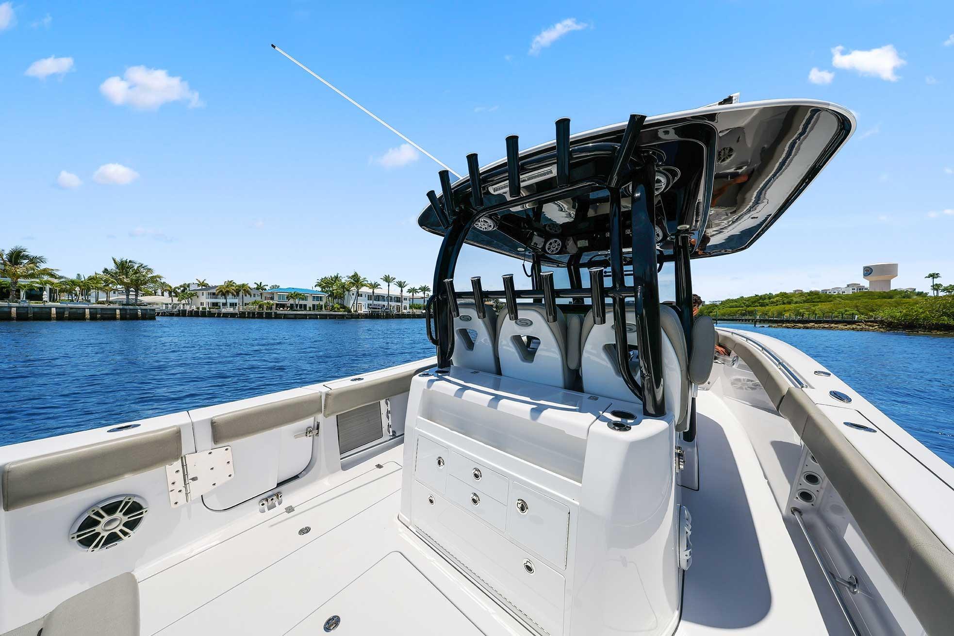 2024 Sportsman Open 352 Center Console boat on calm water, clear sky background.