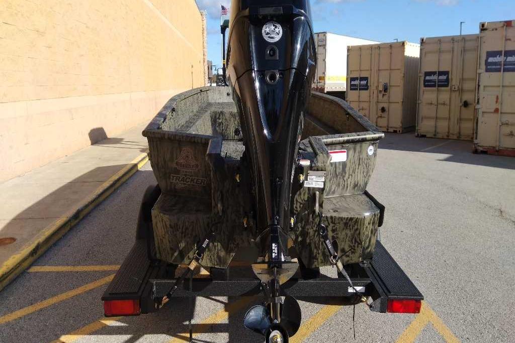 2026 Tracker Grizzly 1650 T Prairie Wings Edition boat on trailer, rear view.