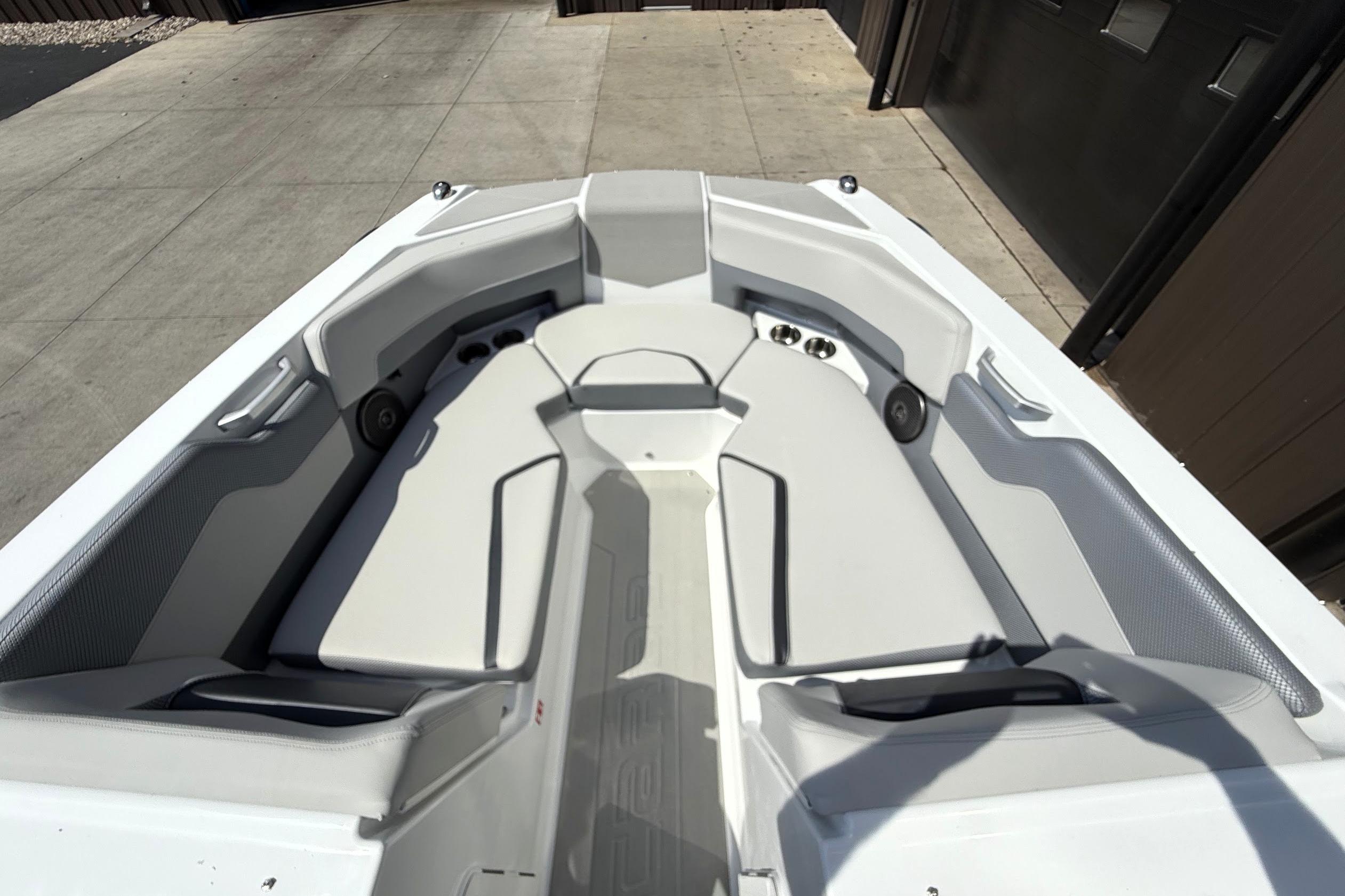 2026 Scarab 235 SE boat interior with sleek white seating and modern design.