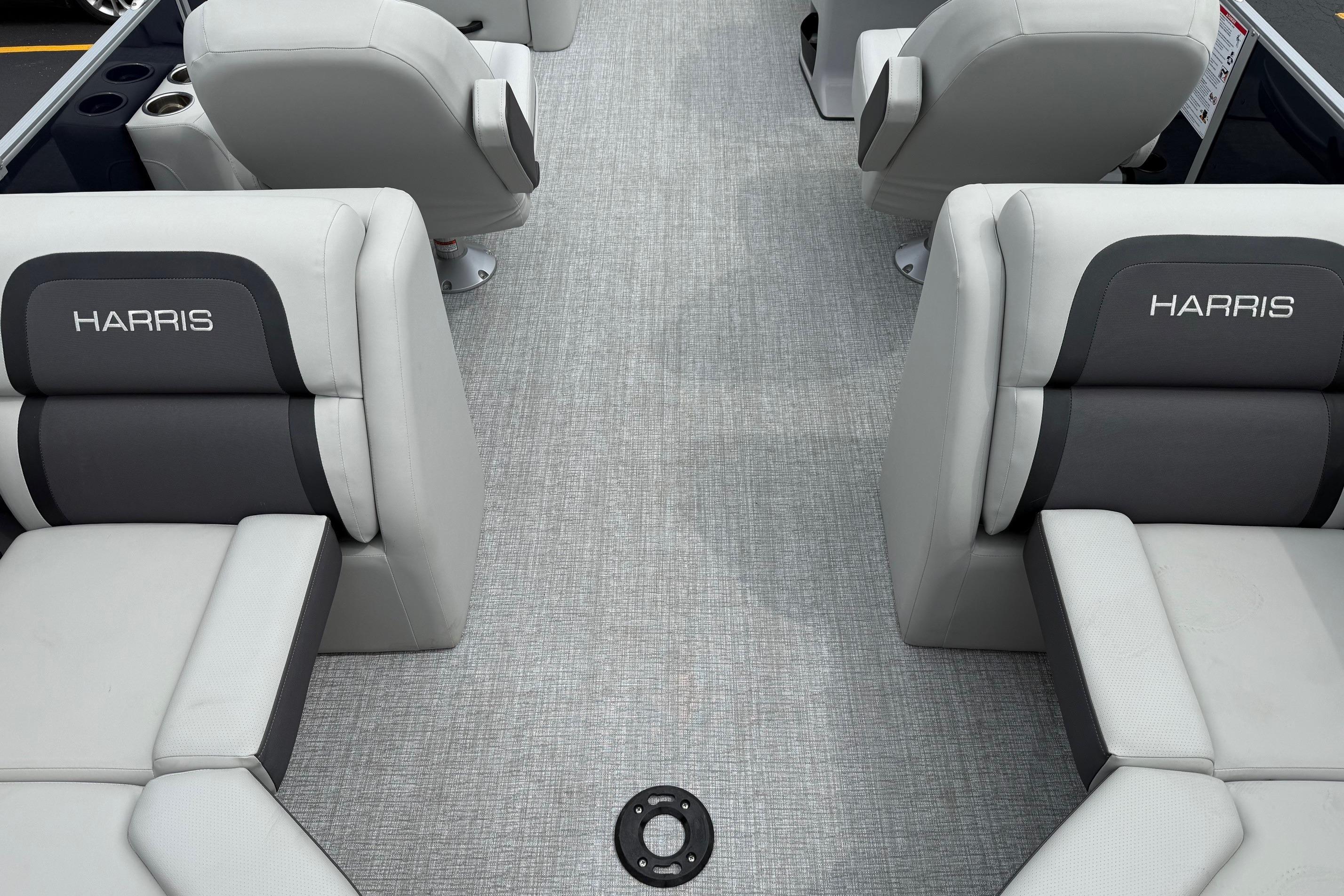 2025 Harris Cruiser 230 boat interior with gray seating and Harris branding.