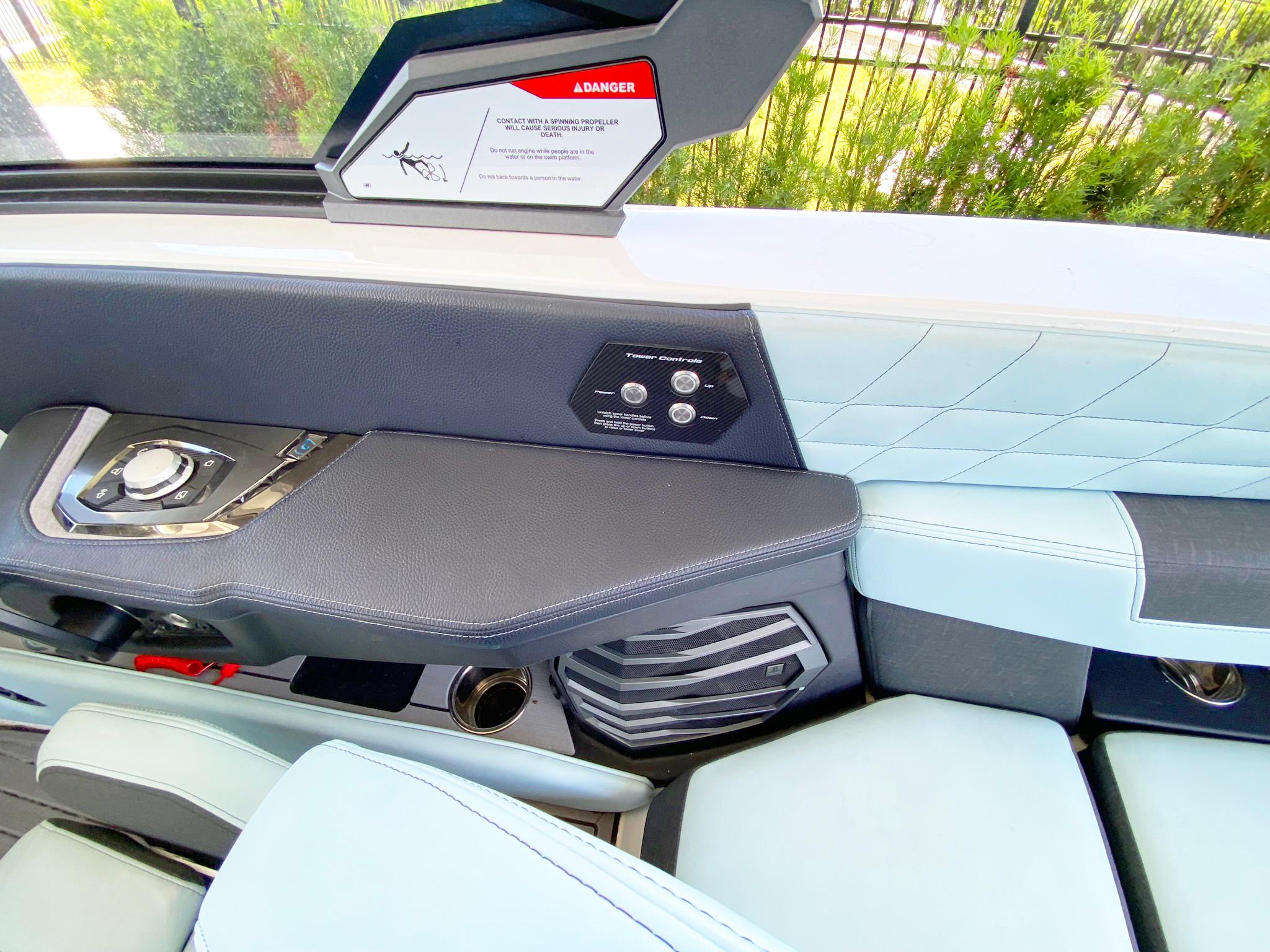 2024 Nautique Super Air Nautique G21 interior with control panel and seating.