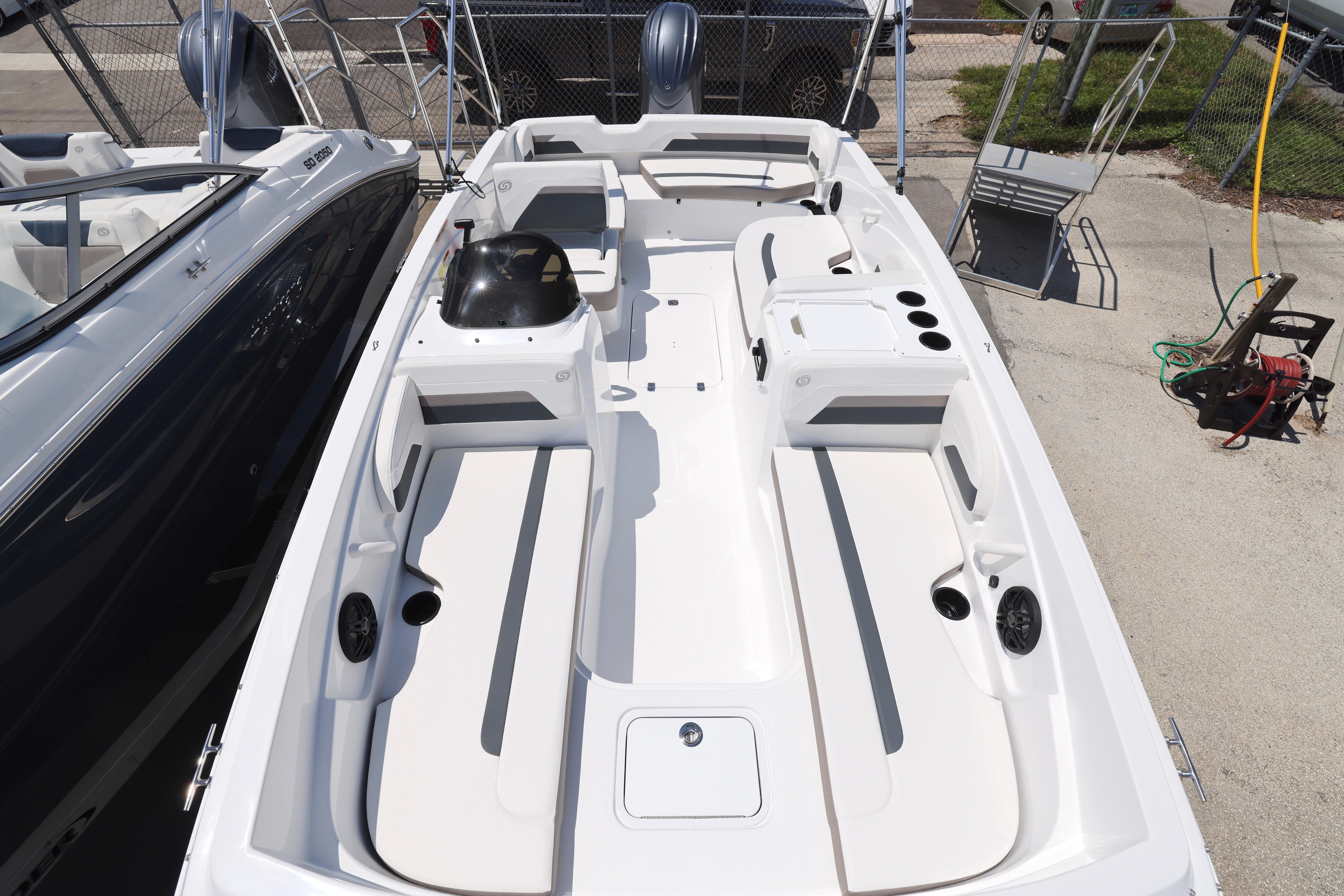 2026 Hurricane SunDeck Sport 205 OB boat interior with seating and storage compartments.