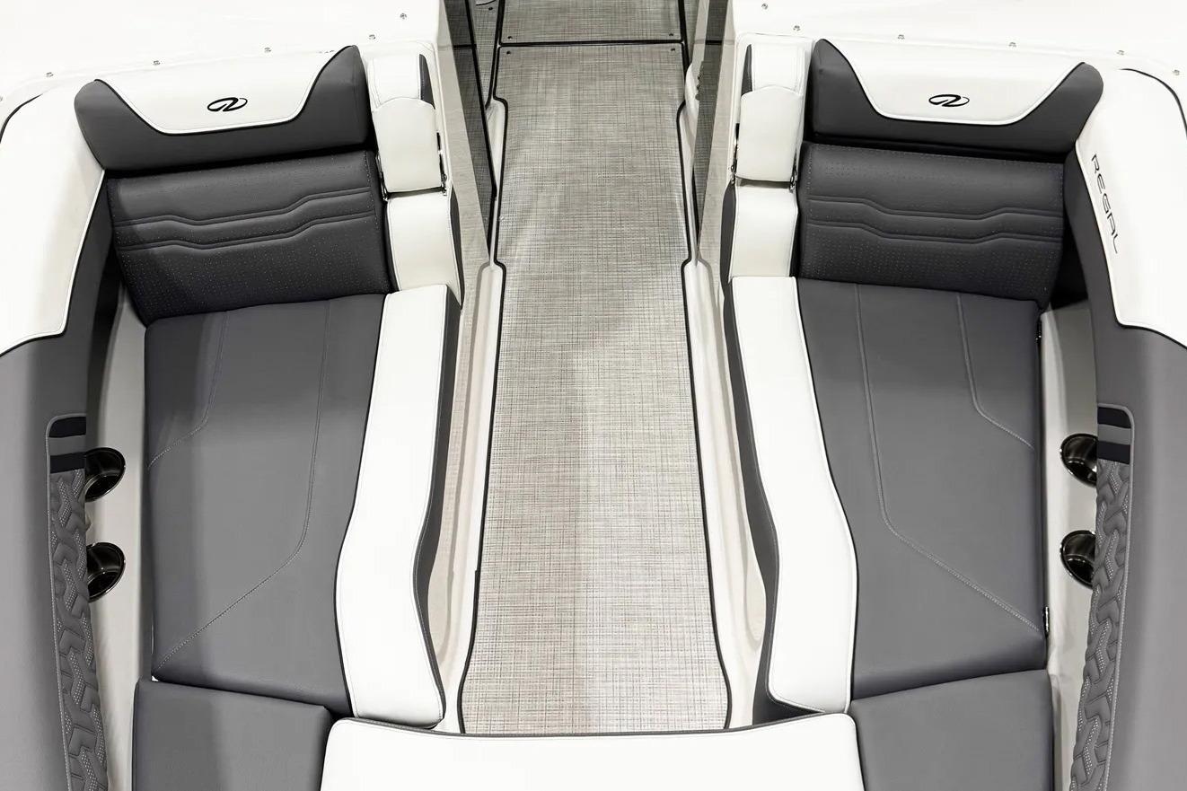 Luxurious interior of 2026 Regal LX9 boat with sleek gray and white seating.