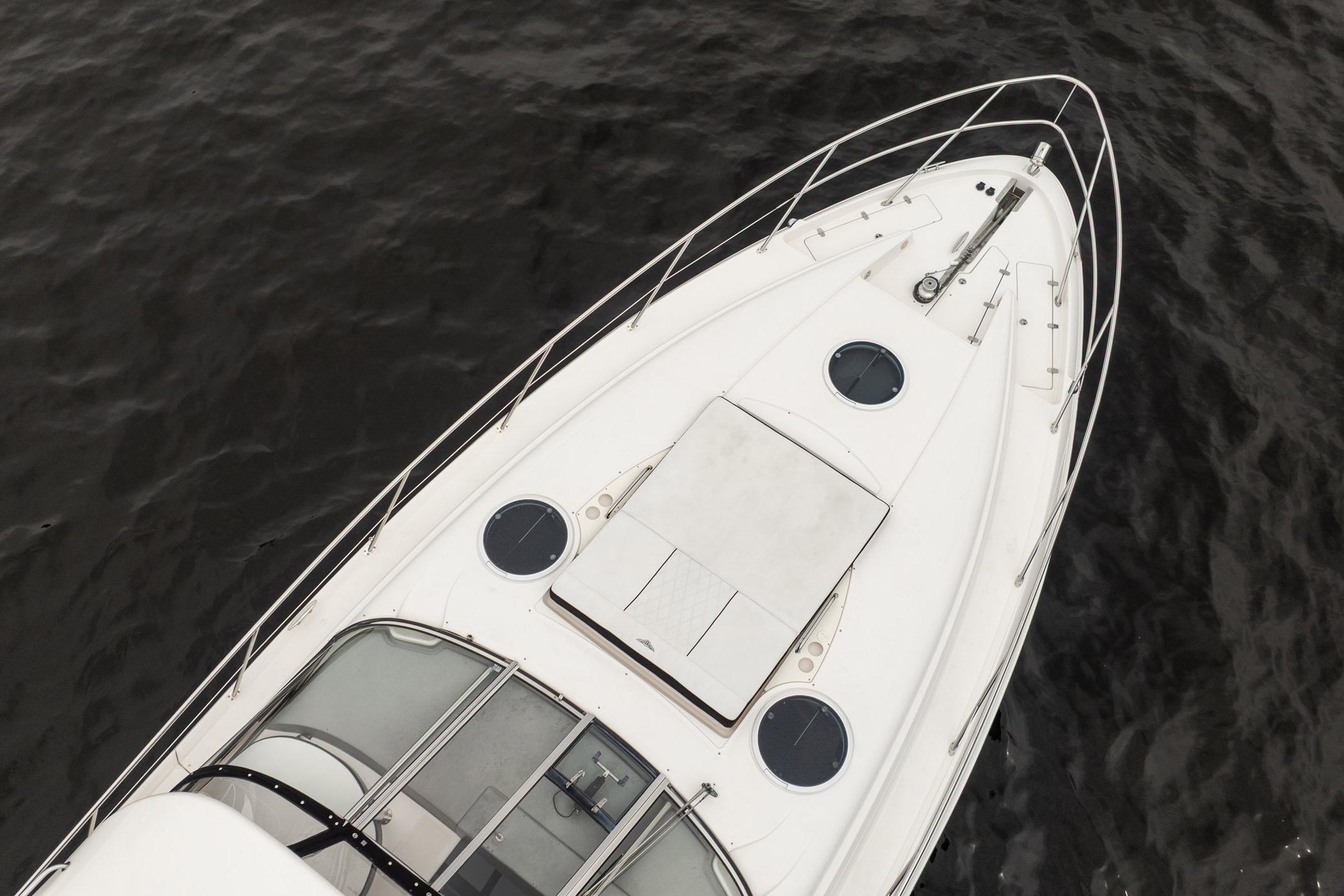 Top view of 2008 Regal Commodore 4460 yacht on dark water.