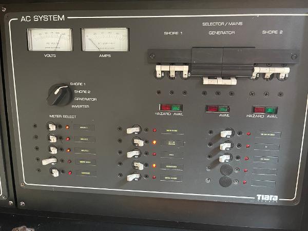 2003 Tiara Yachts 3500 Open AC system control panel with volt and amp meters.