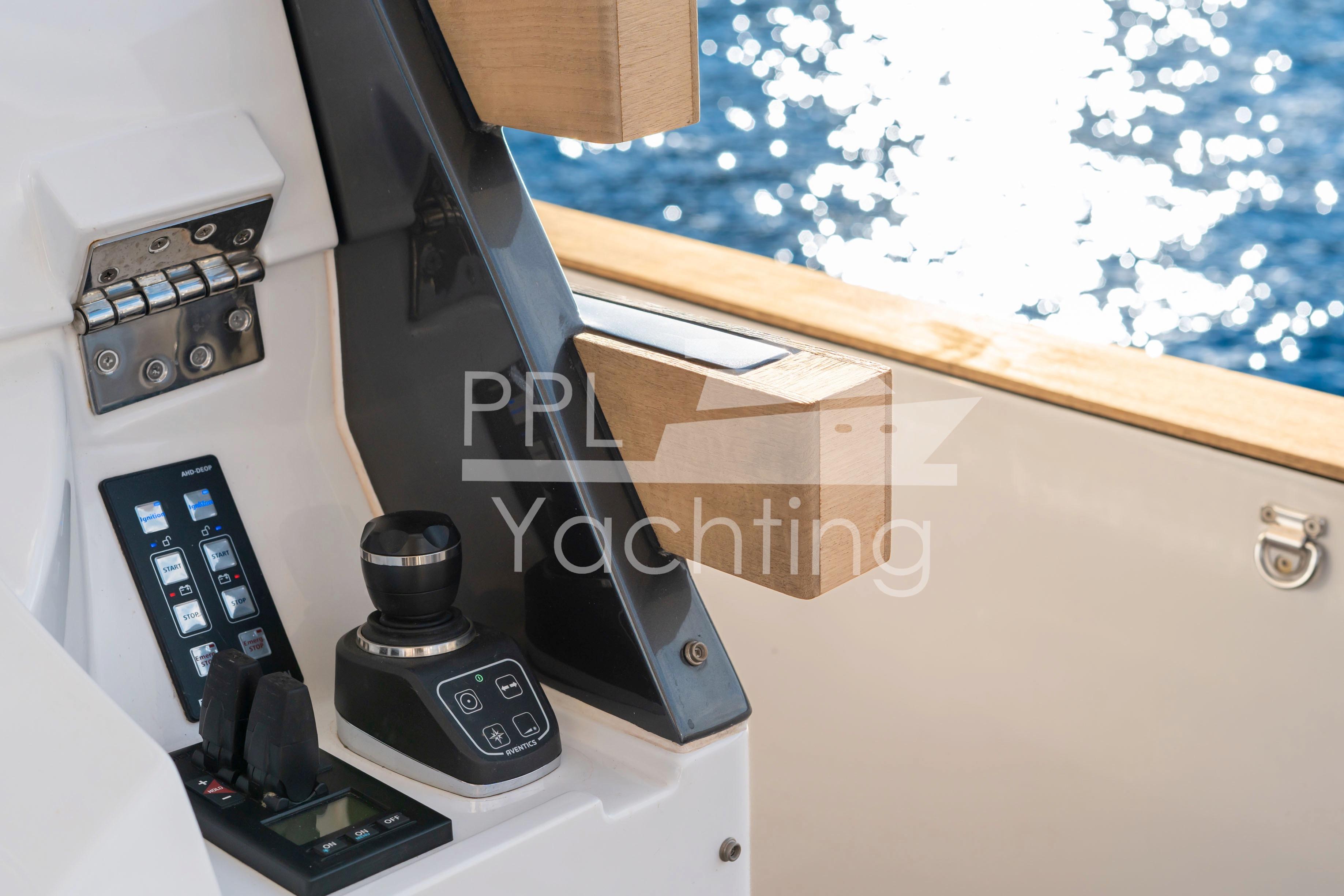 Control panel of 2021 Azimut Magellano 66 yacht with ocean view.