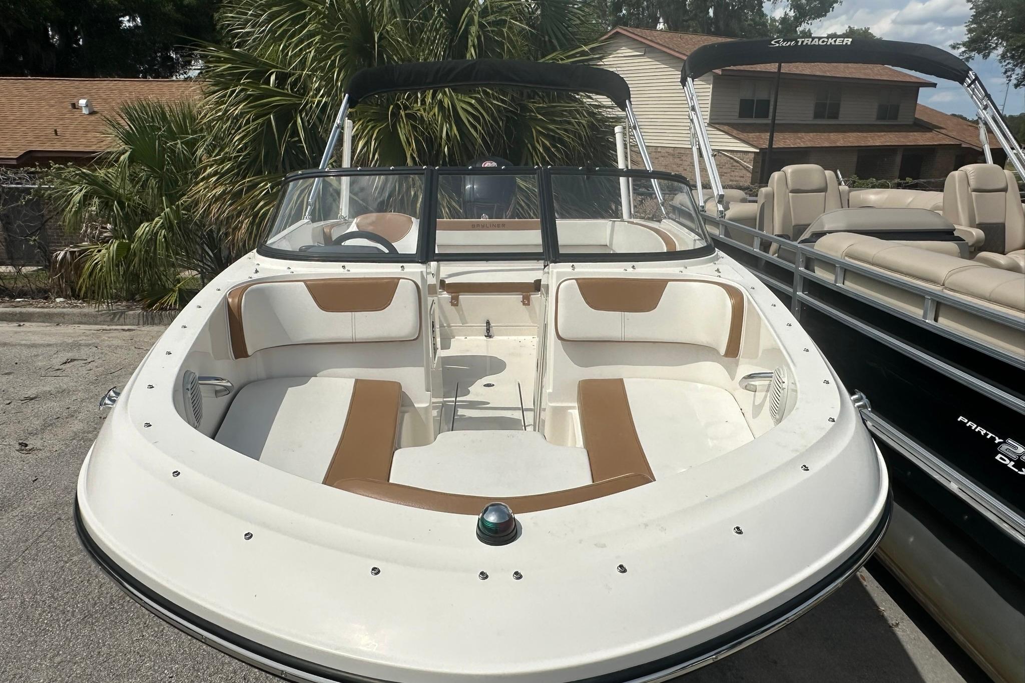 2019 Bayliner VR4 Bowrider OB with spacious seating, parked outdoors.