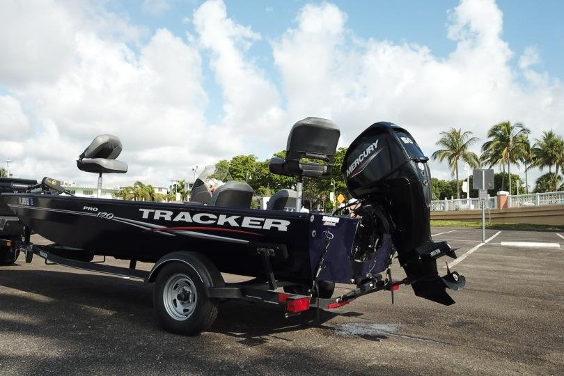 2020 Tracker Pro 170 boat with Mercury engine on trailer, parked outdoors.