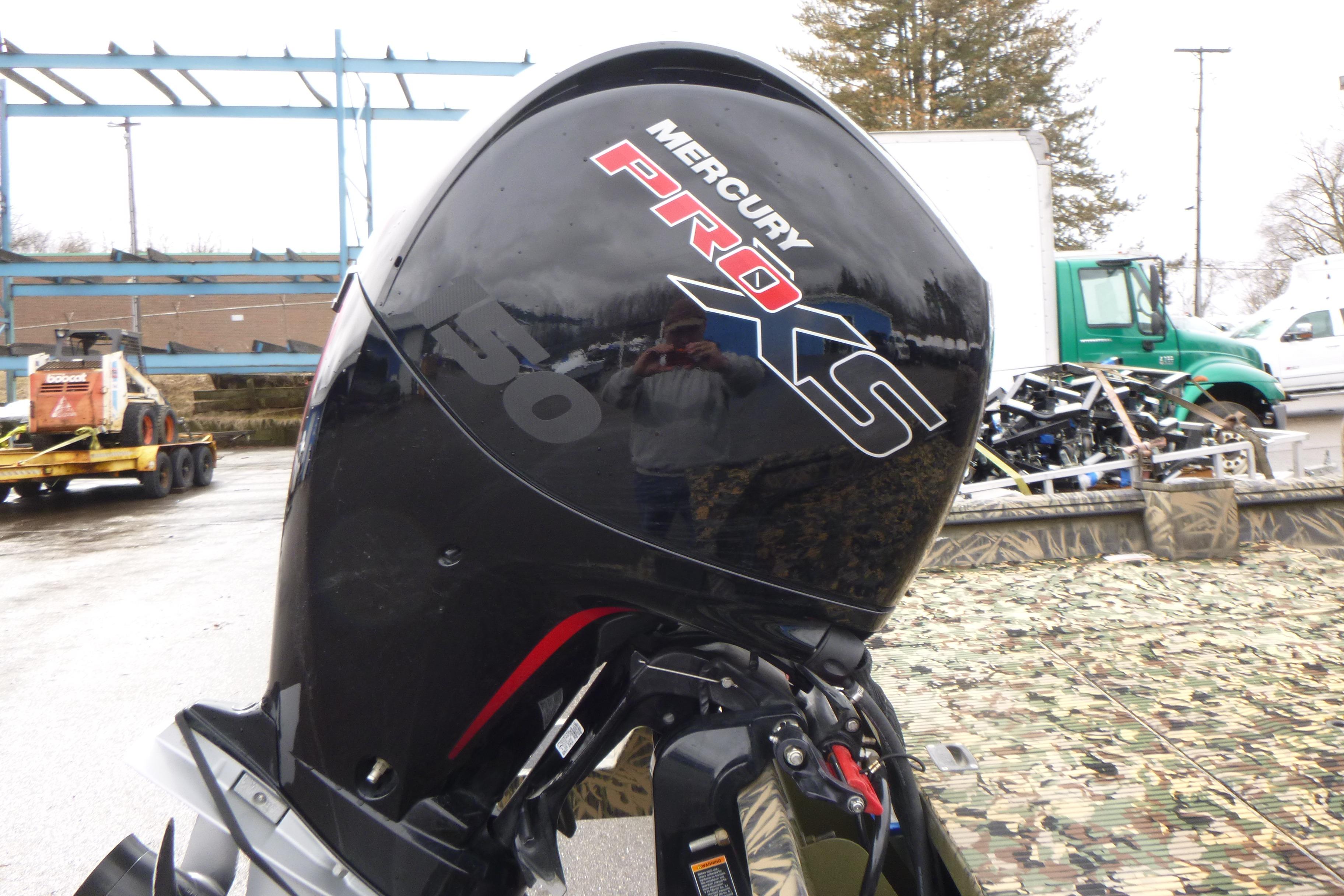 Mercury Pro XS outboard motor on 2024 Lowe Roughneck 2070 boat, outdoor setting.