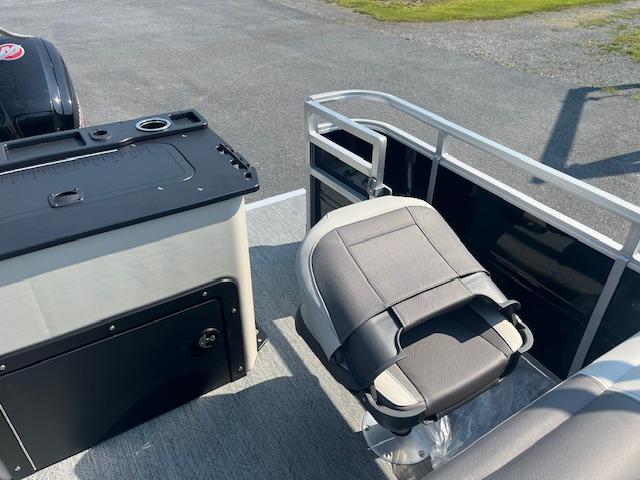 2026 Sun Tracker Fishin' Barge 20 DLX interior with seating and storage.