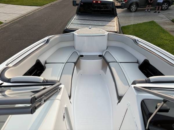 Interior view of a 2021 Yamaha AR250 boat with seating area.