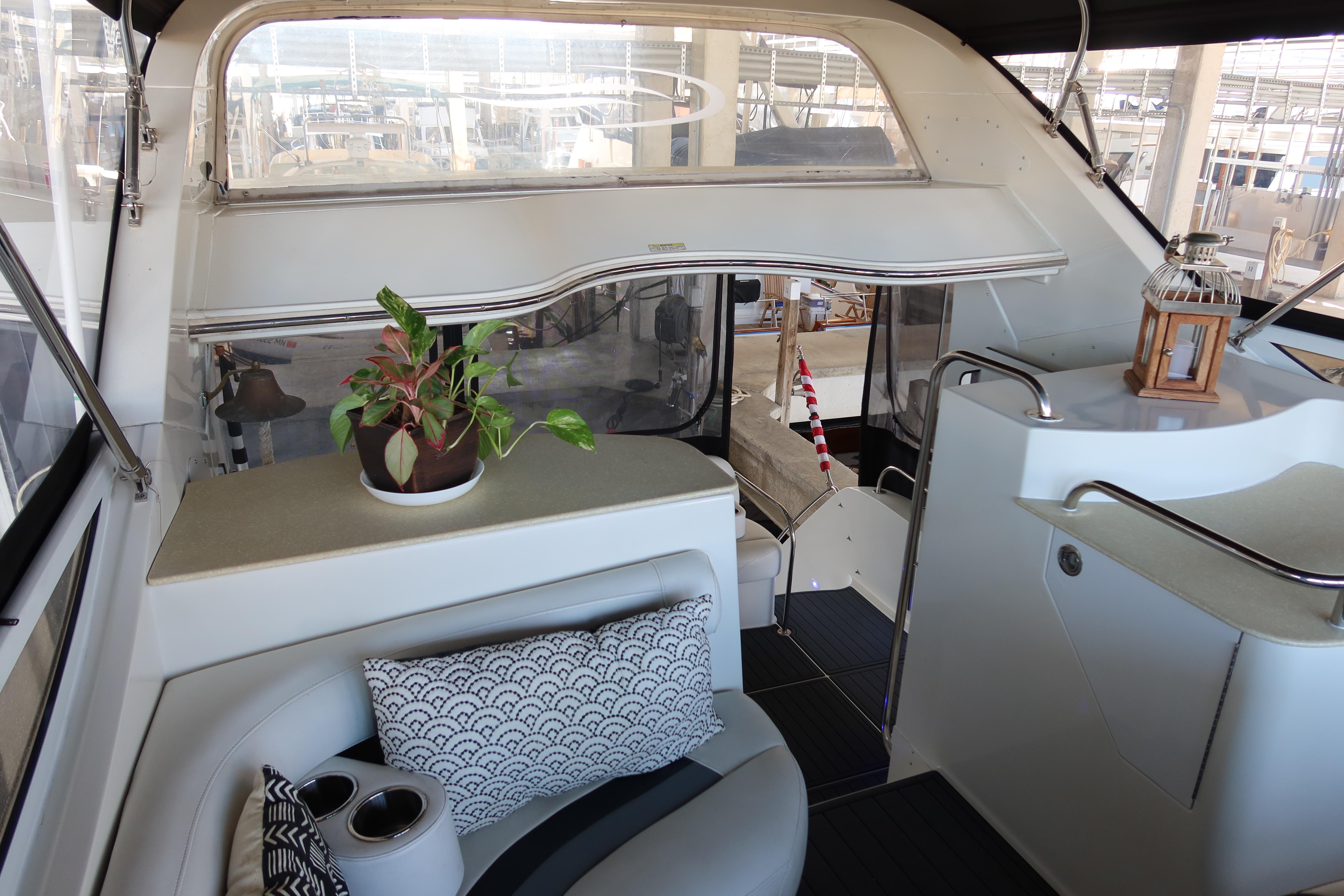 Interior of 2006 Carver 43 CMY yacht with seating, plants, and decor.